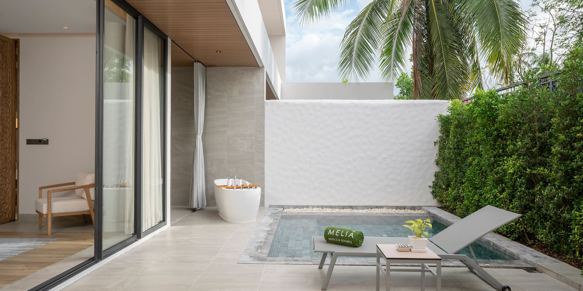 a pool and lounge chair in a backyard