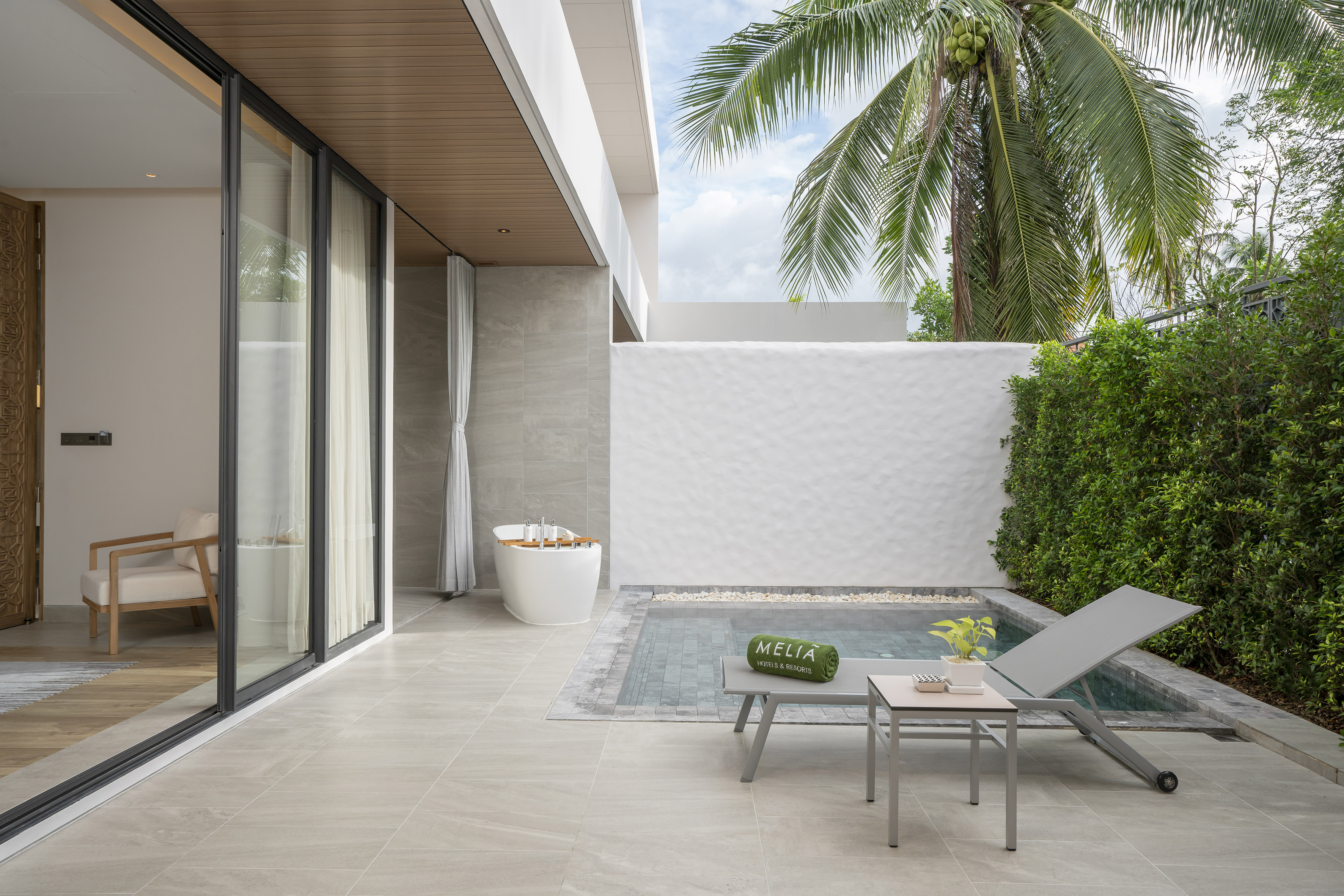 Melia resort patio with private plunge pool and outdoor bathtub.