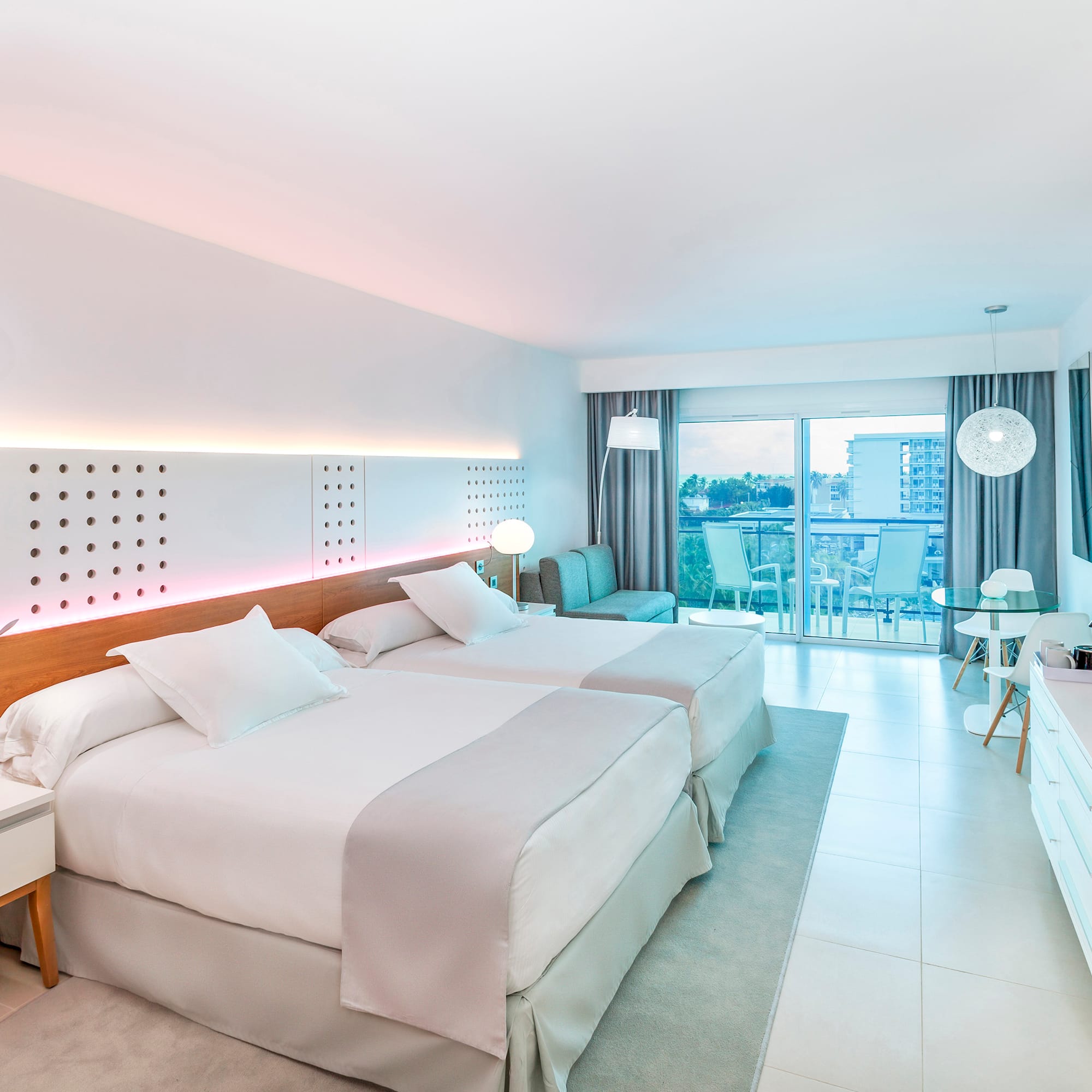 a room with two beds and a table