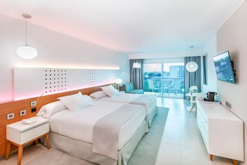 a room with two beds and a table