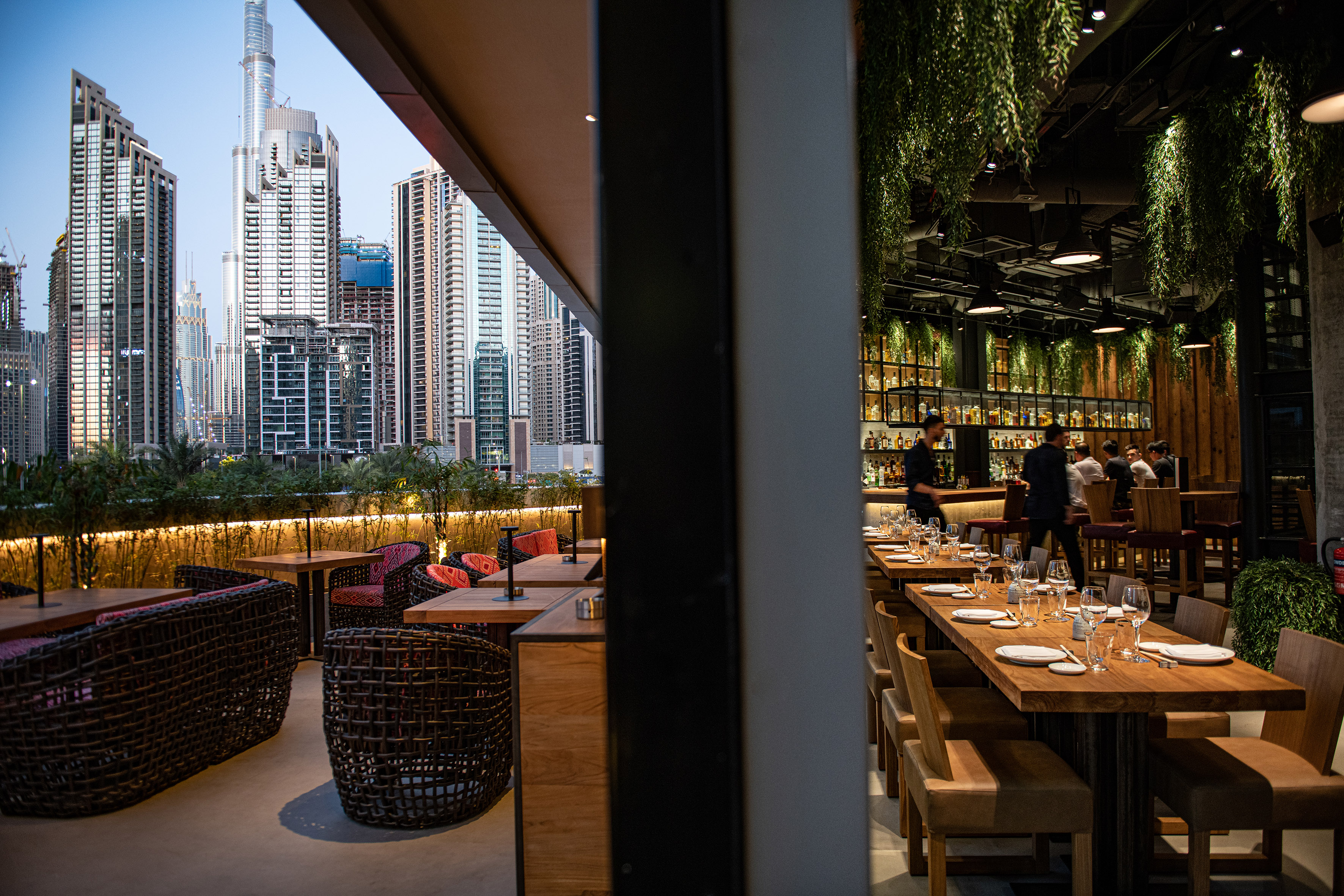 Upscale Dubai restaurant with city view terrace and sophisticated bar.