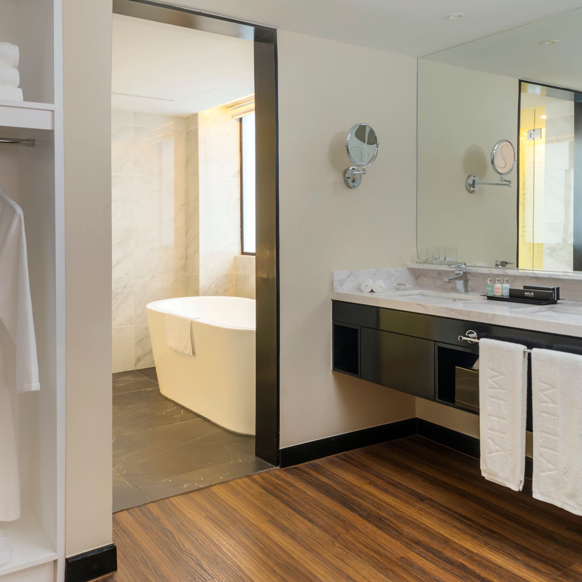 a bathroom with a bathtub and a mirror