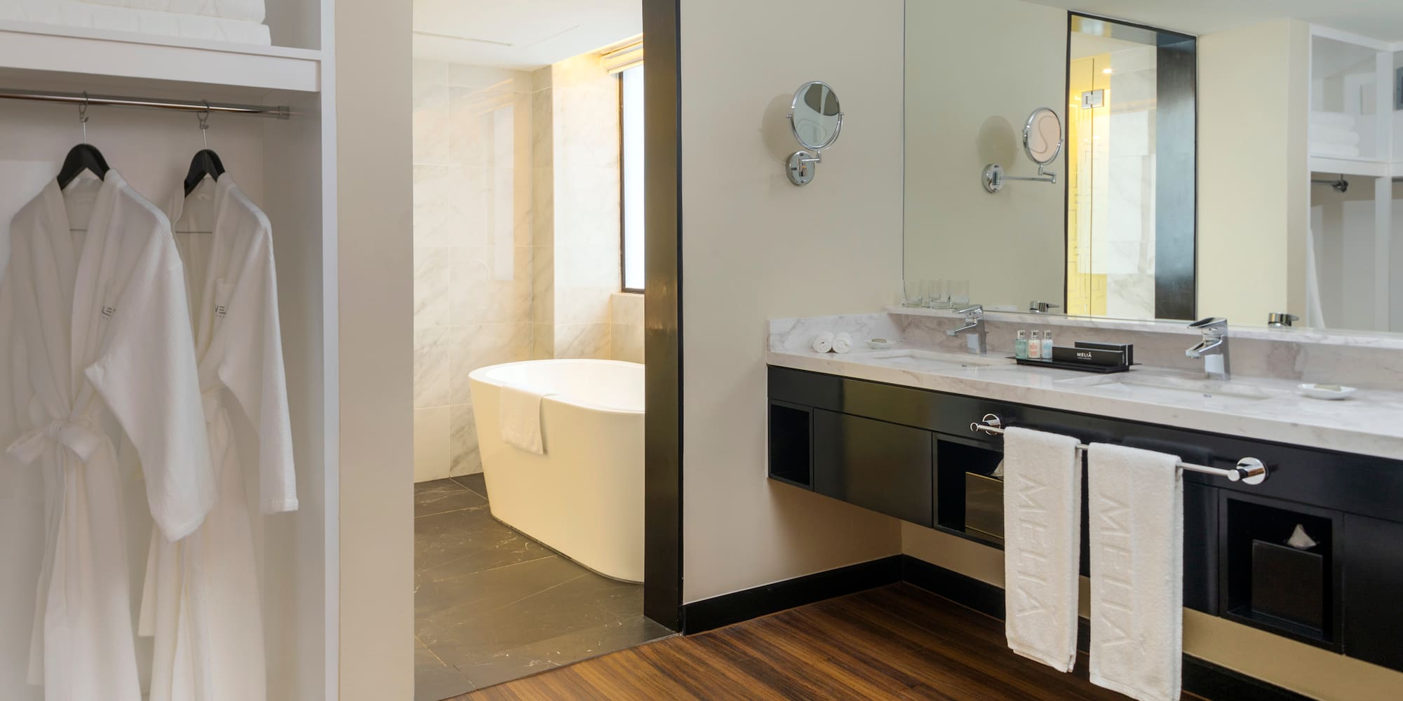 a bathroom with a bathtub and a mirror