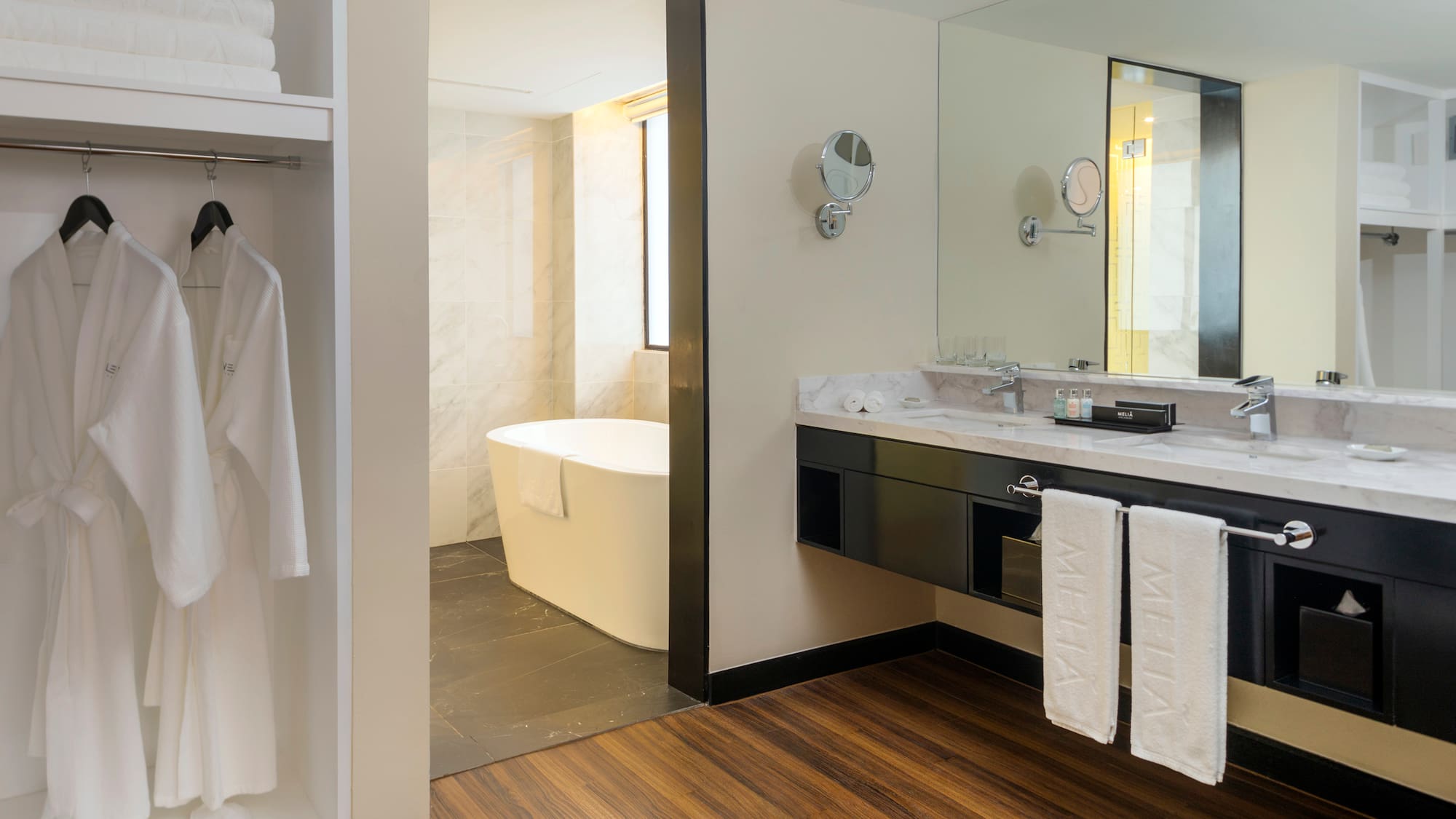 a bathroom with a bathtub and a mirror