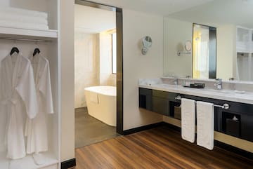 a bathroom with a bathtub and a mirror