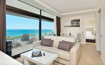 a living room with a view of the ocean