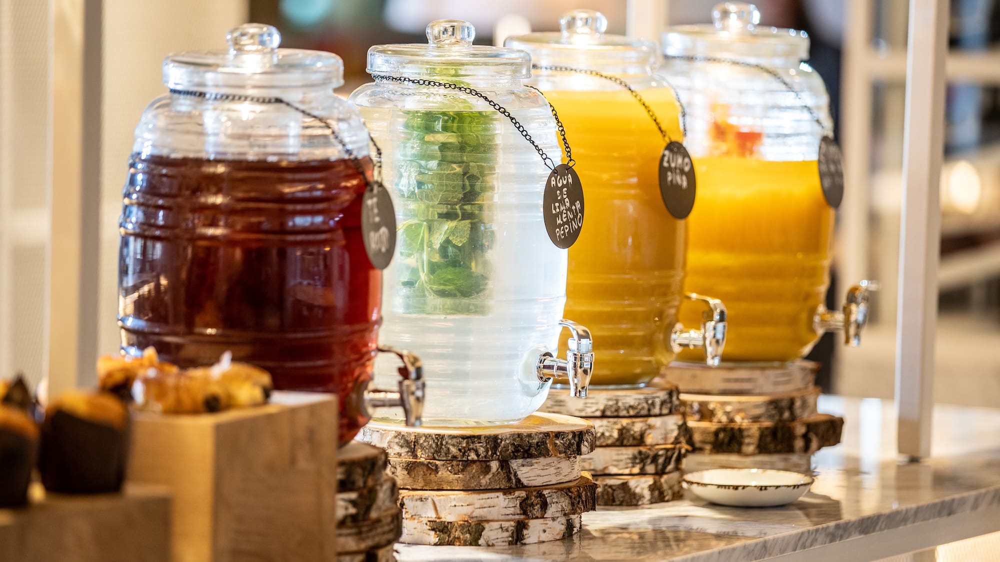 a row of different colored drinks