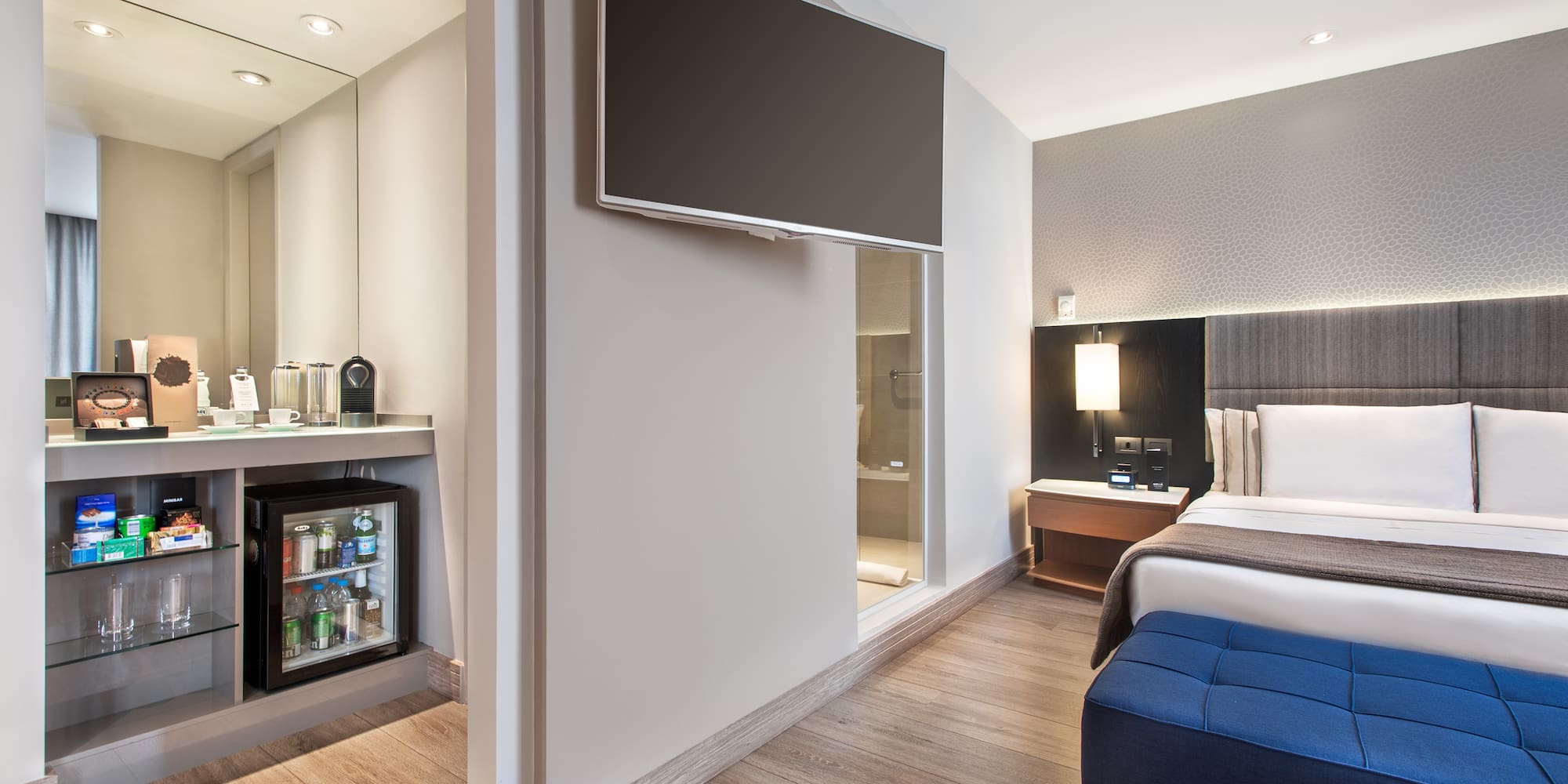 a room with a bed and a tv