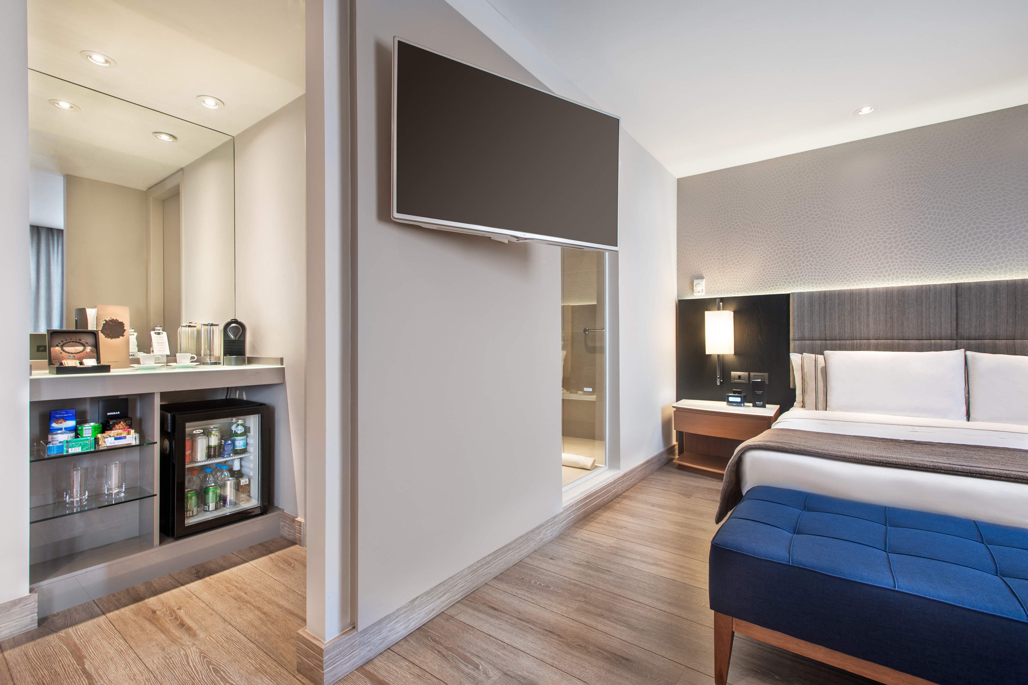 a room with a bed and a tv