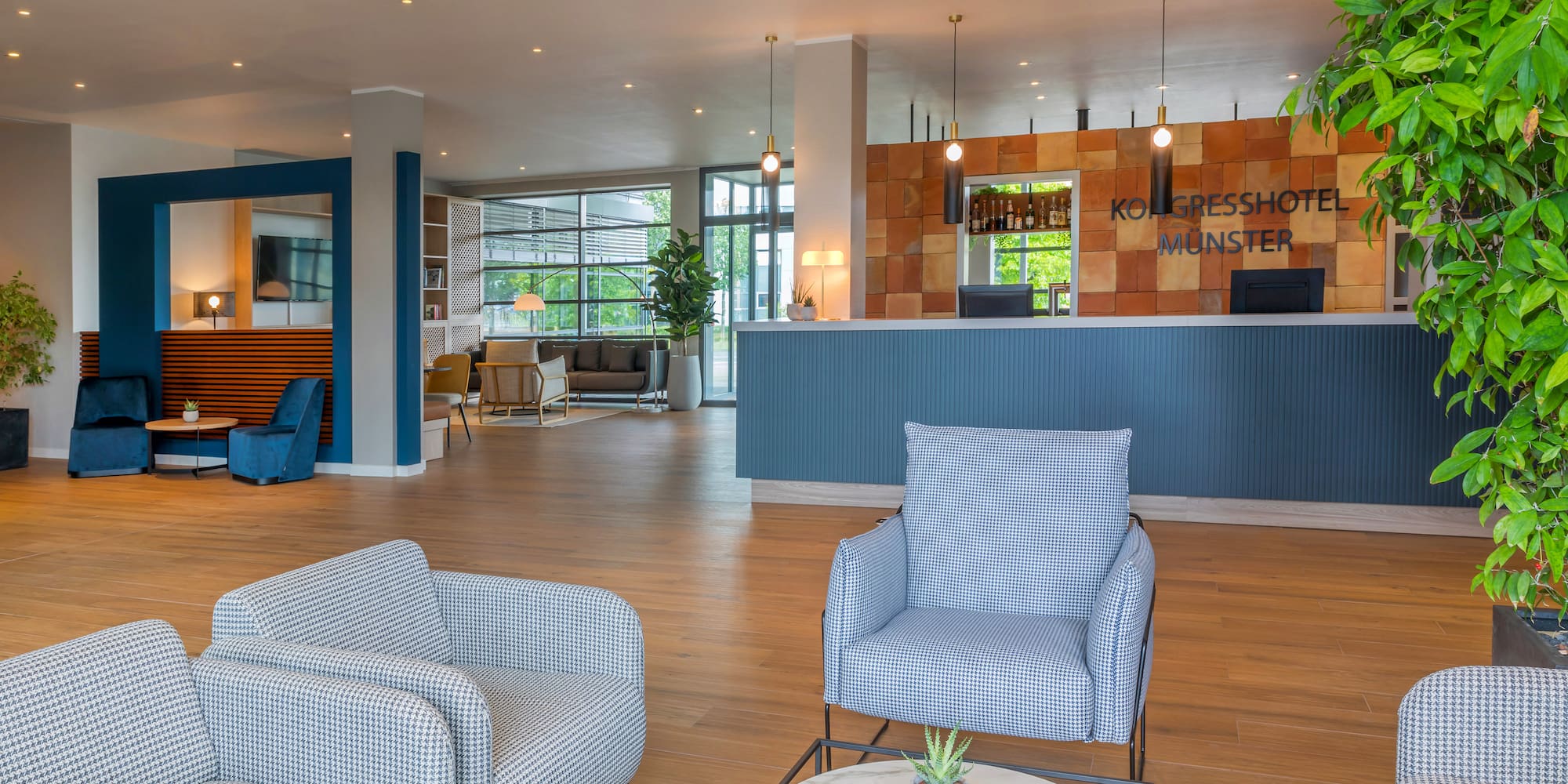 a lobby with chairs and a table