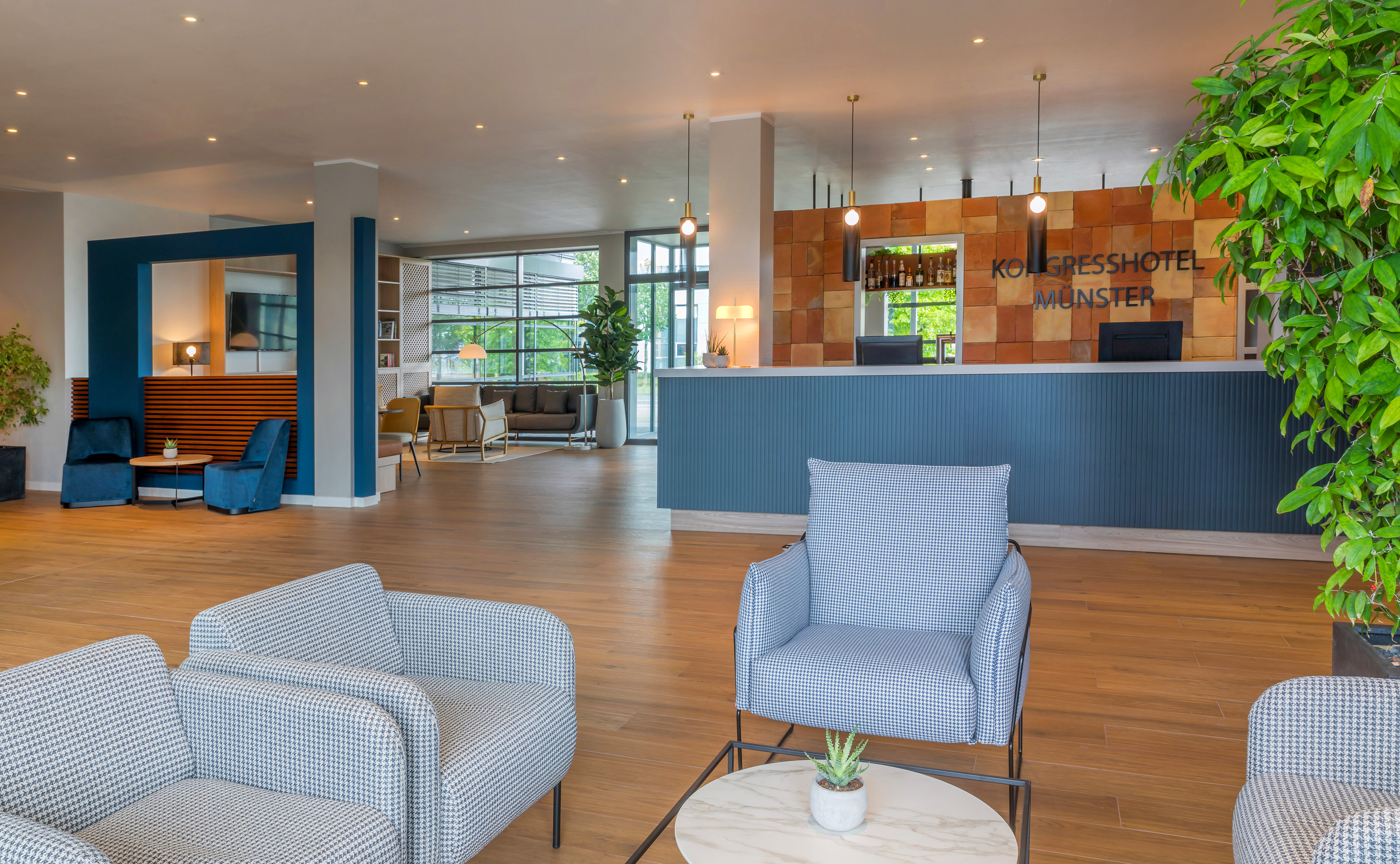 a lobby with chairs and a table