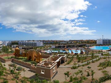 a water park with a playground and a pool