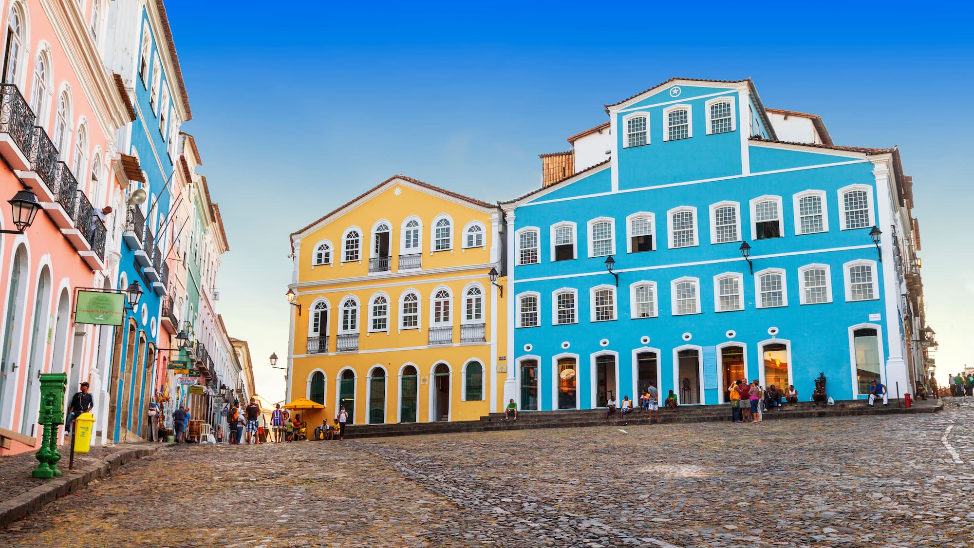 a group of buildings on a cobblestone street