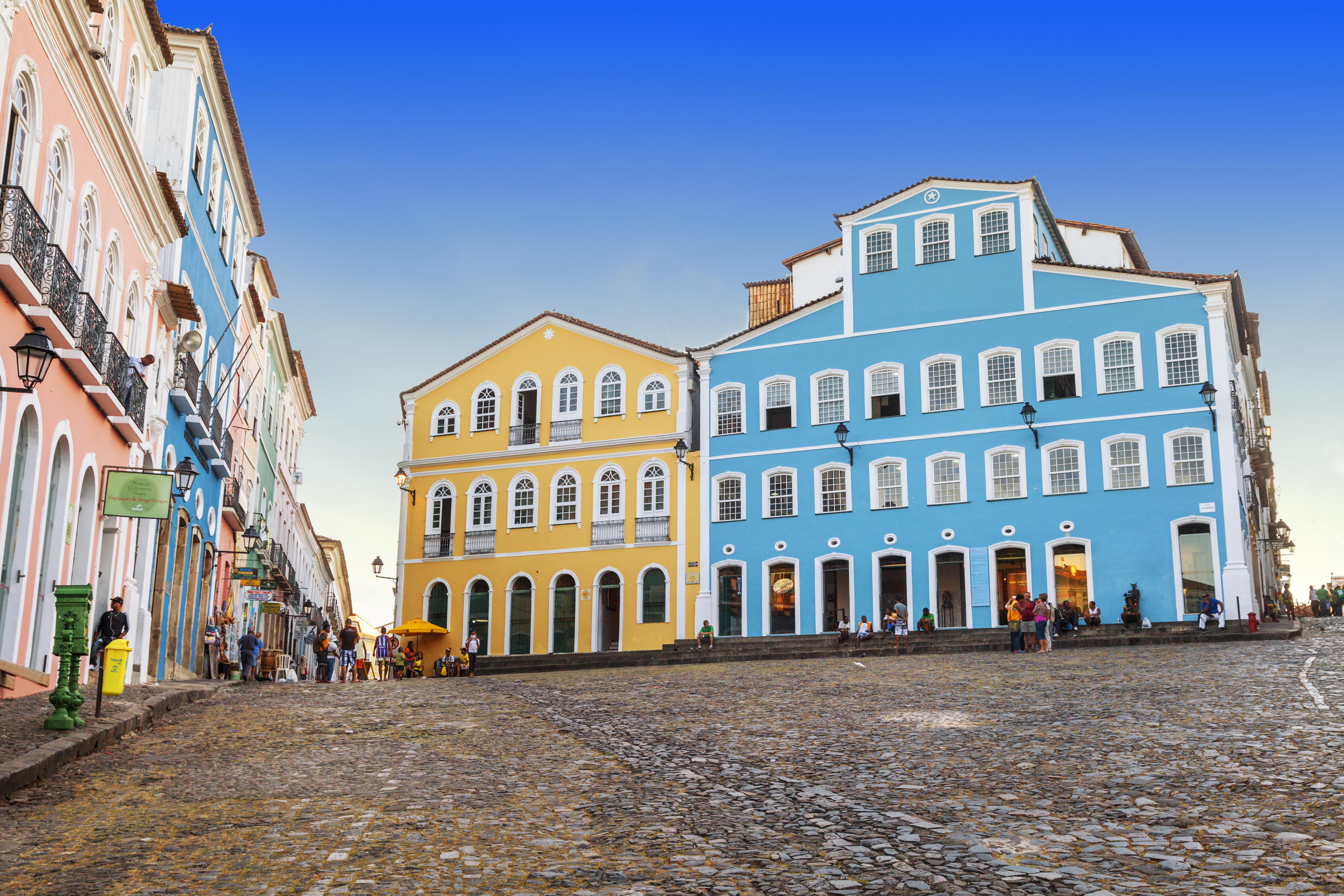 a group of buildings on a cobblestone street