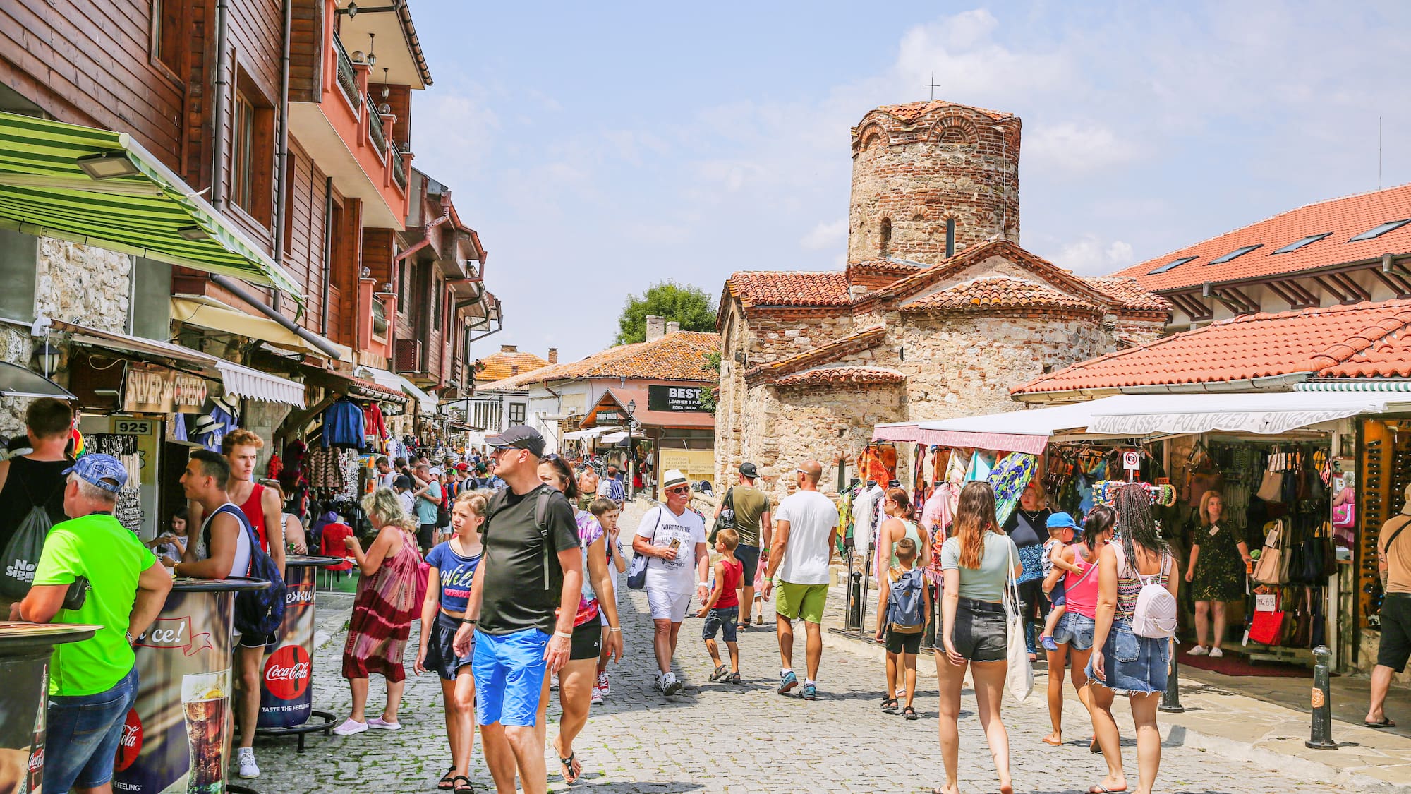 a group of people walking on a street