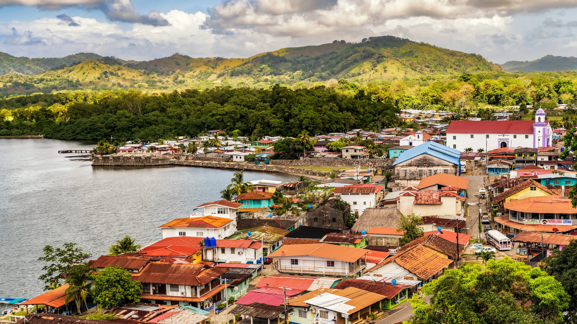 a city with many houses and a body of water