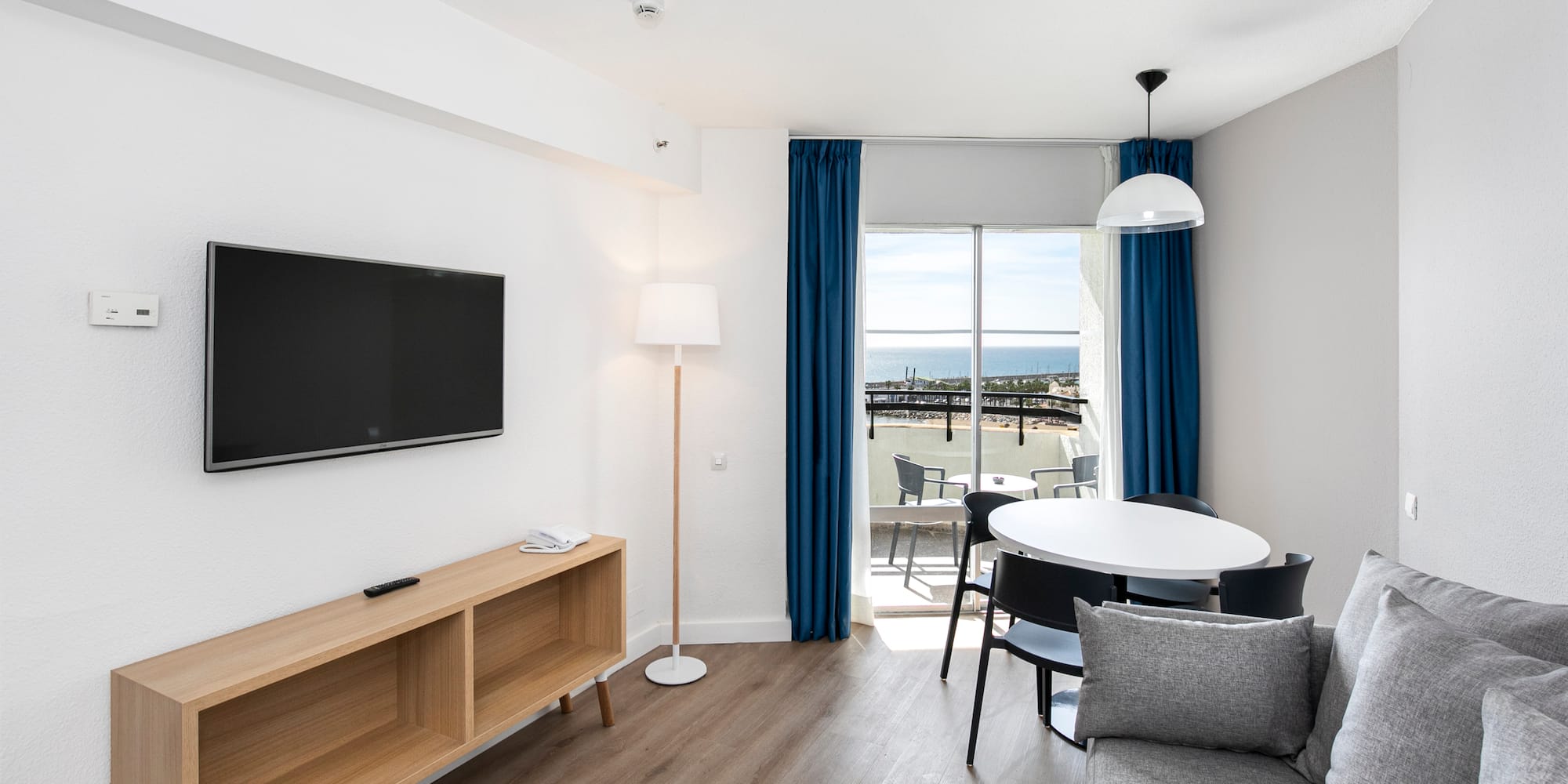 a room with a television and table