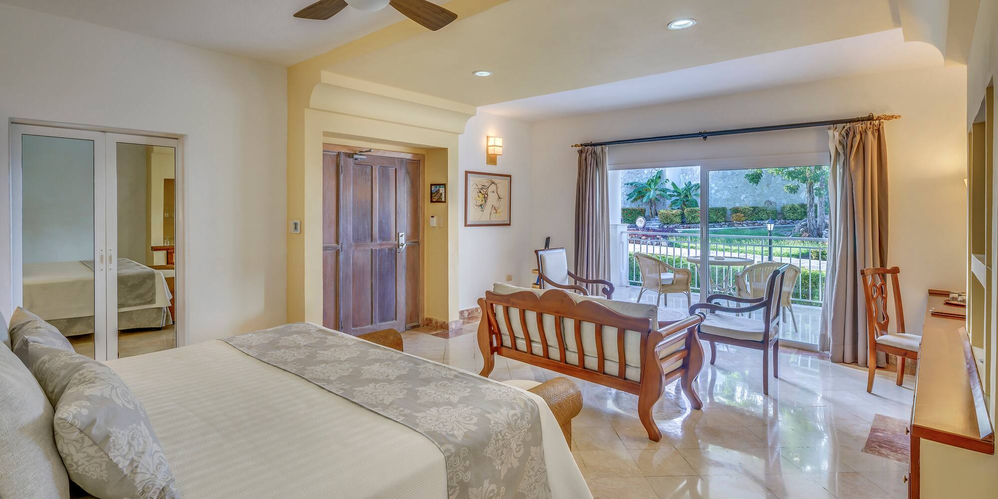 a bedroom with a bed and a wood chair