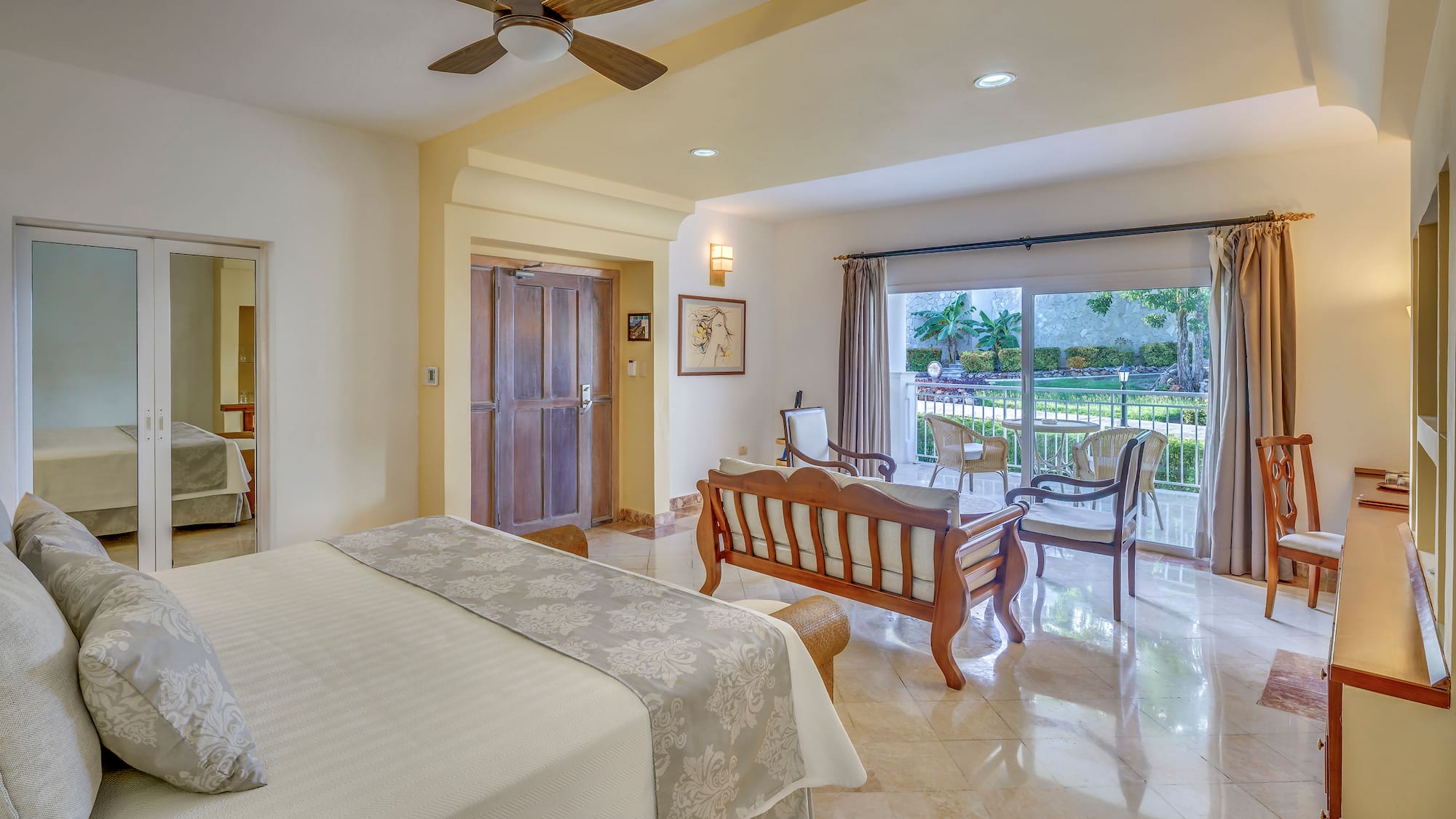 a bedroom with a bed and a wood chair