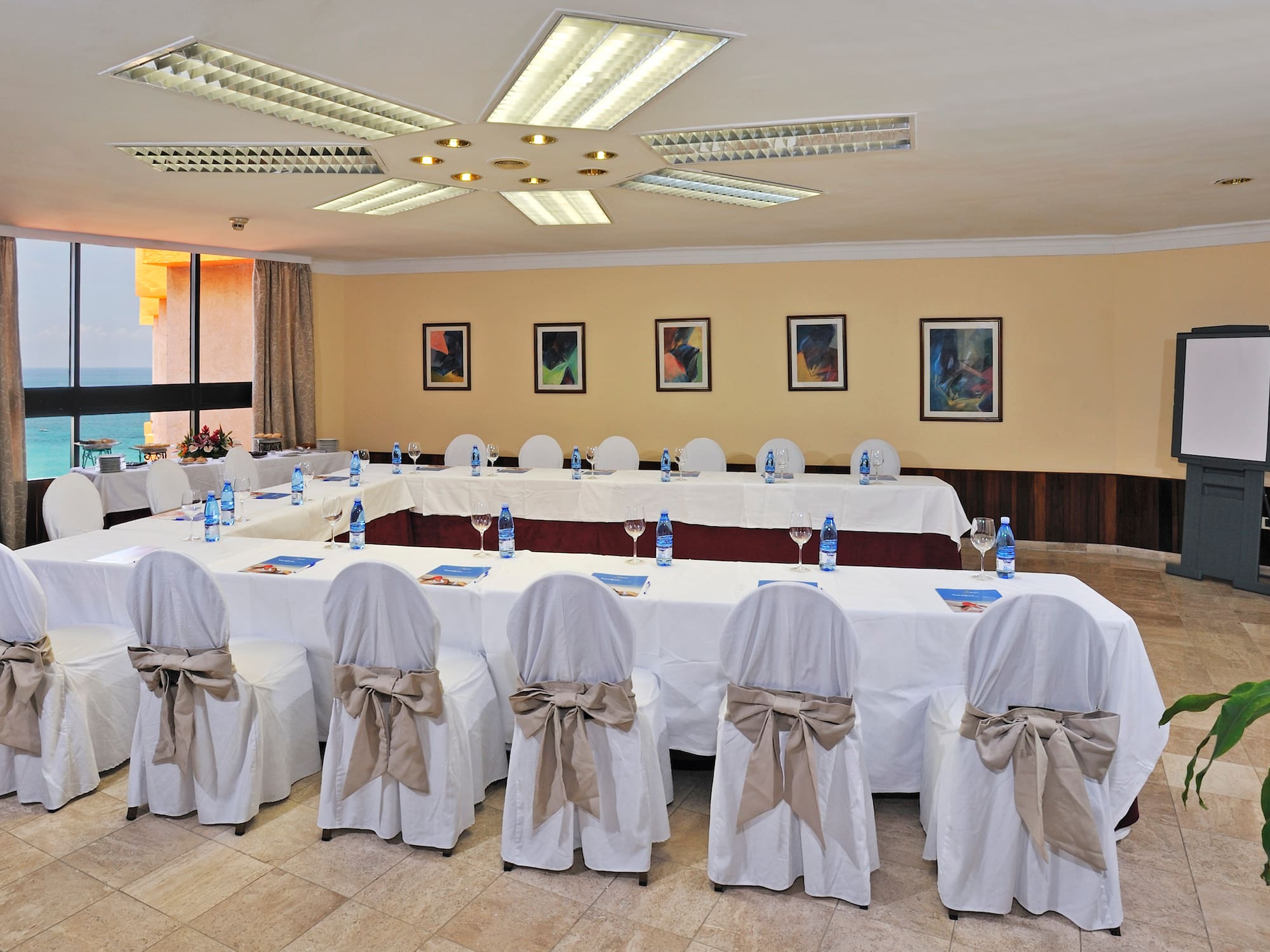 a room with tables and chairs