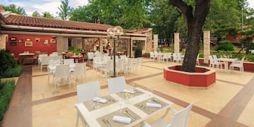a restaurant with tables and chairs