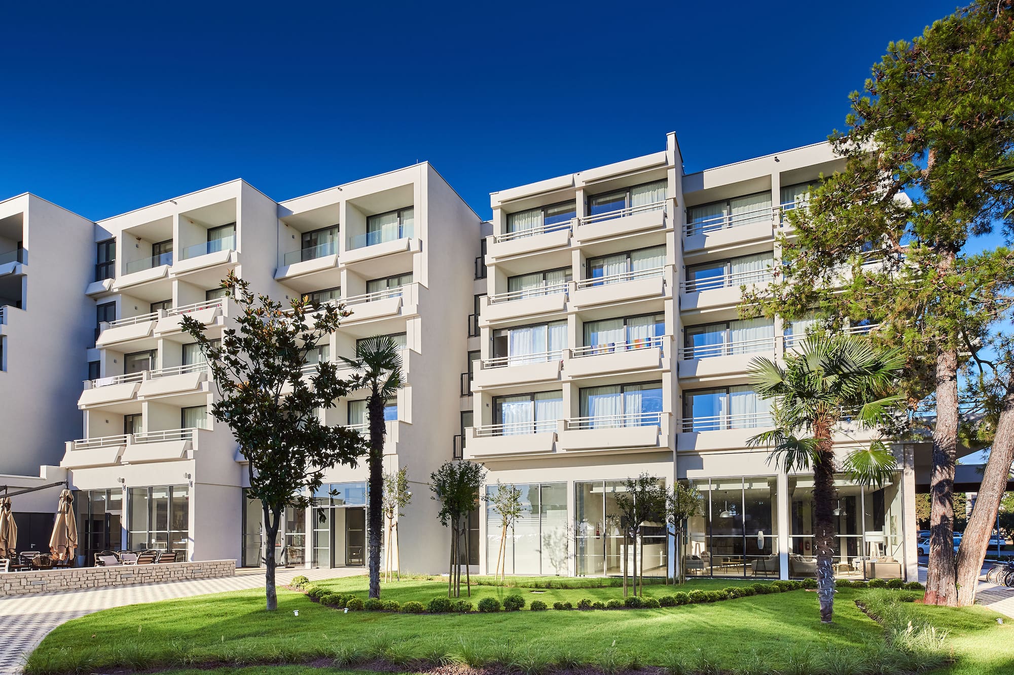 a building with trees and grass