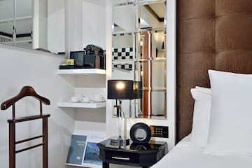 a mirror above a bed