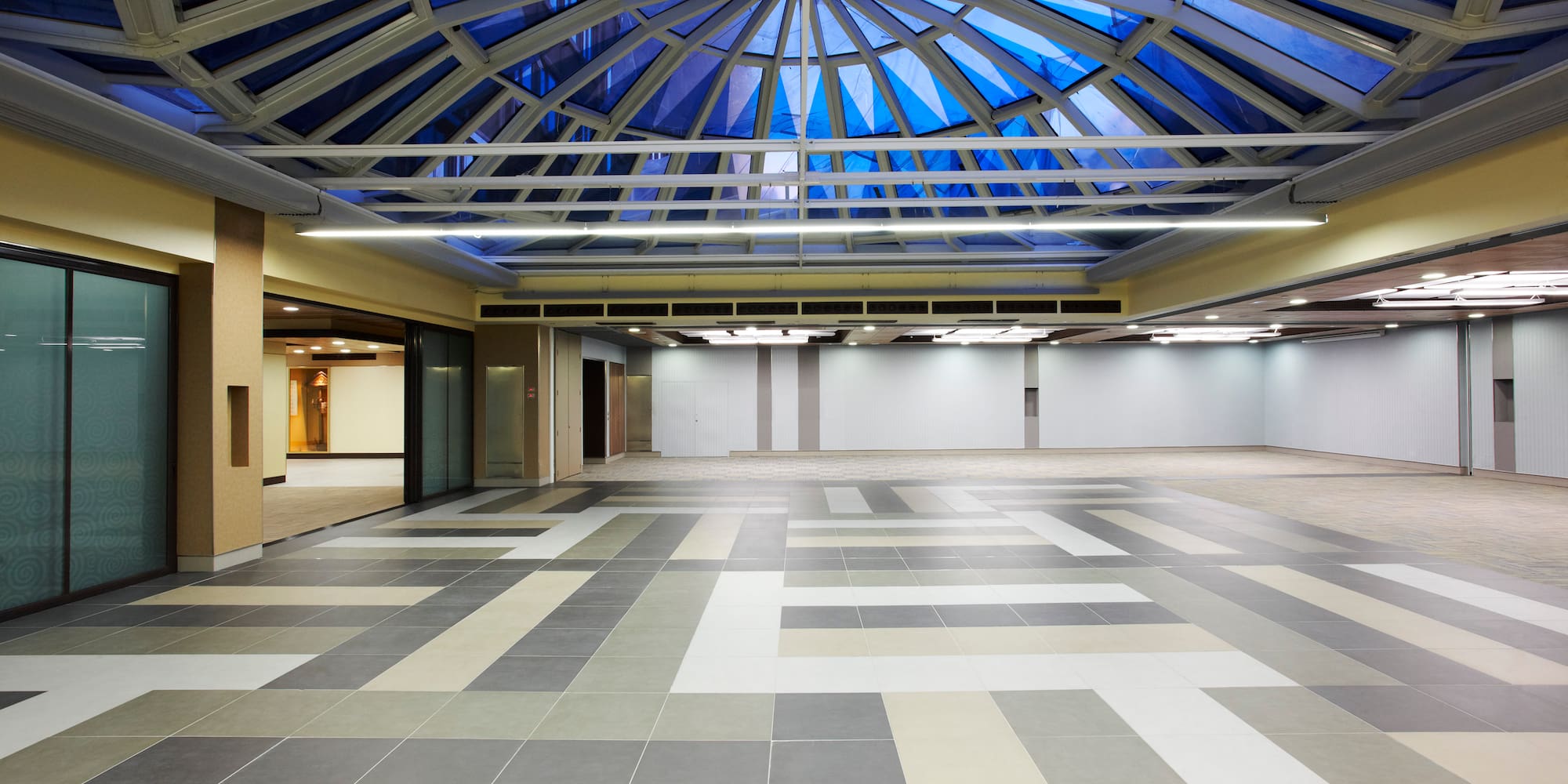 a large room with a glass roof