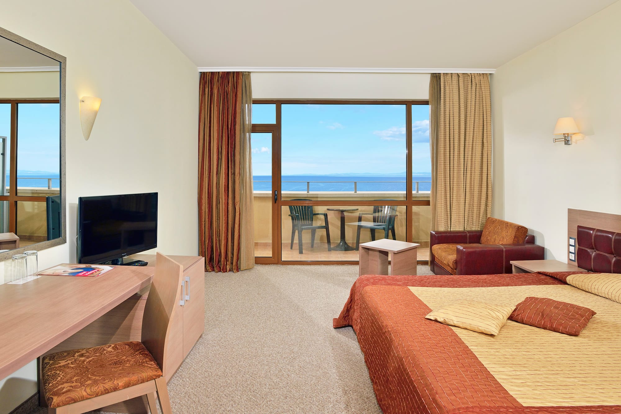 a room with a television and a bed