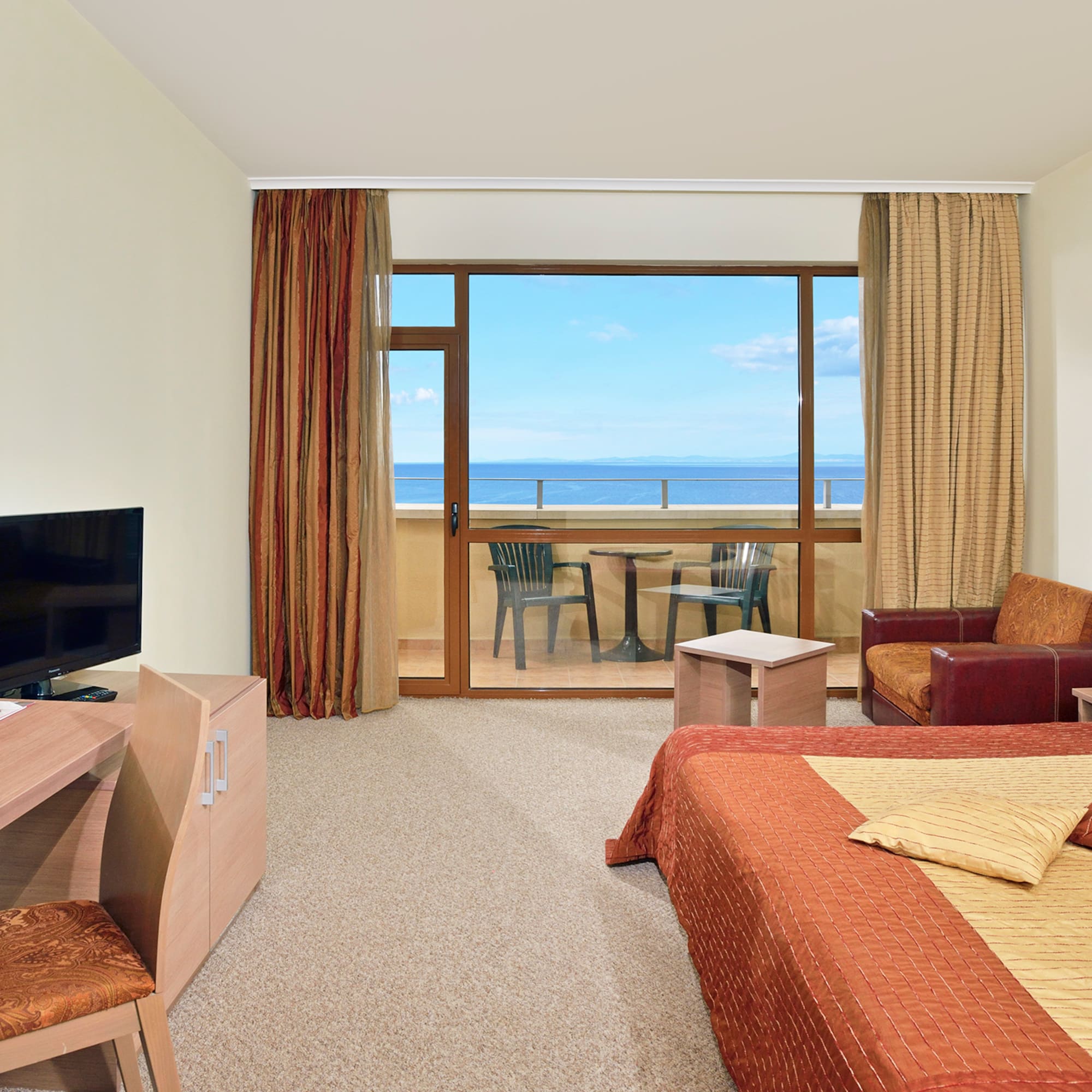 a room with a television and a bed