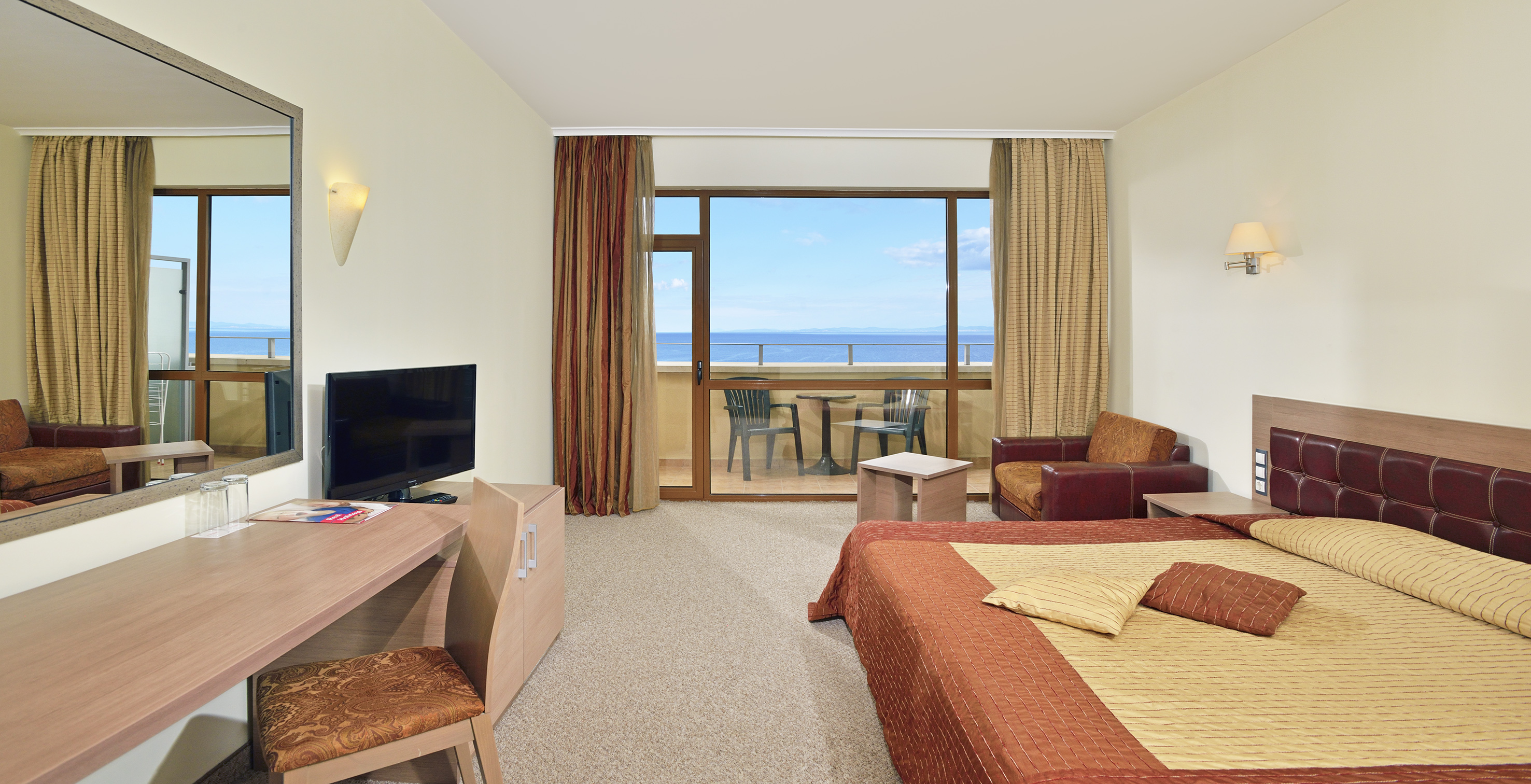 a room with a television and a bed