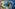 Aerial of Cala Galdana, Majorca: Melia hotel, sandy beach, turquoise bay, sailboats.