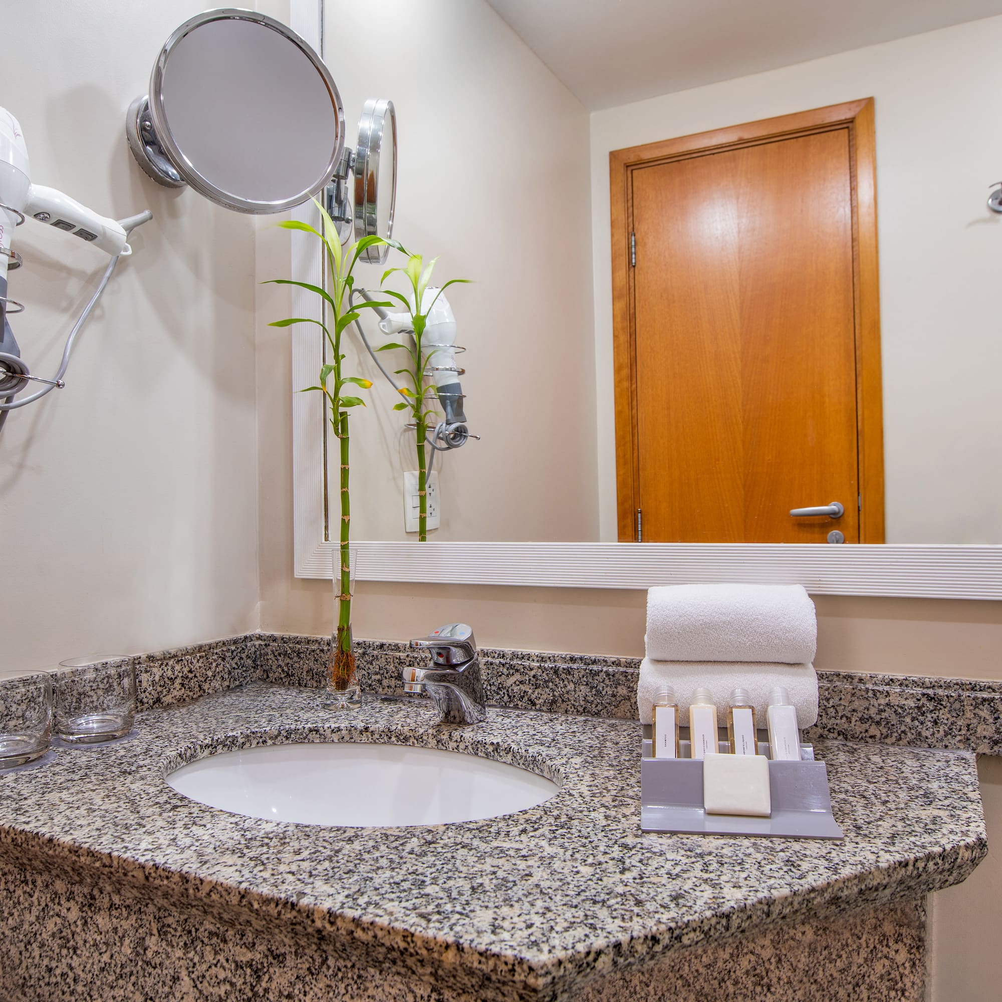 a bathroom with a mirror and a sink