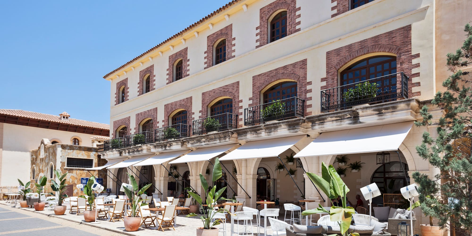a building with tables and chairs outside