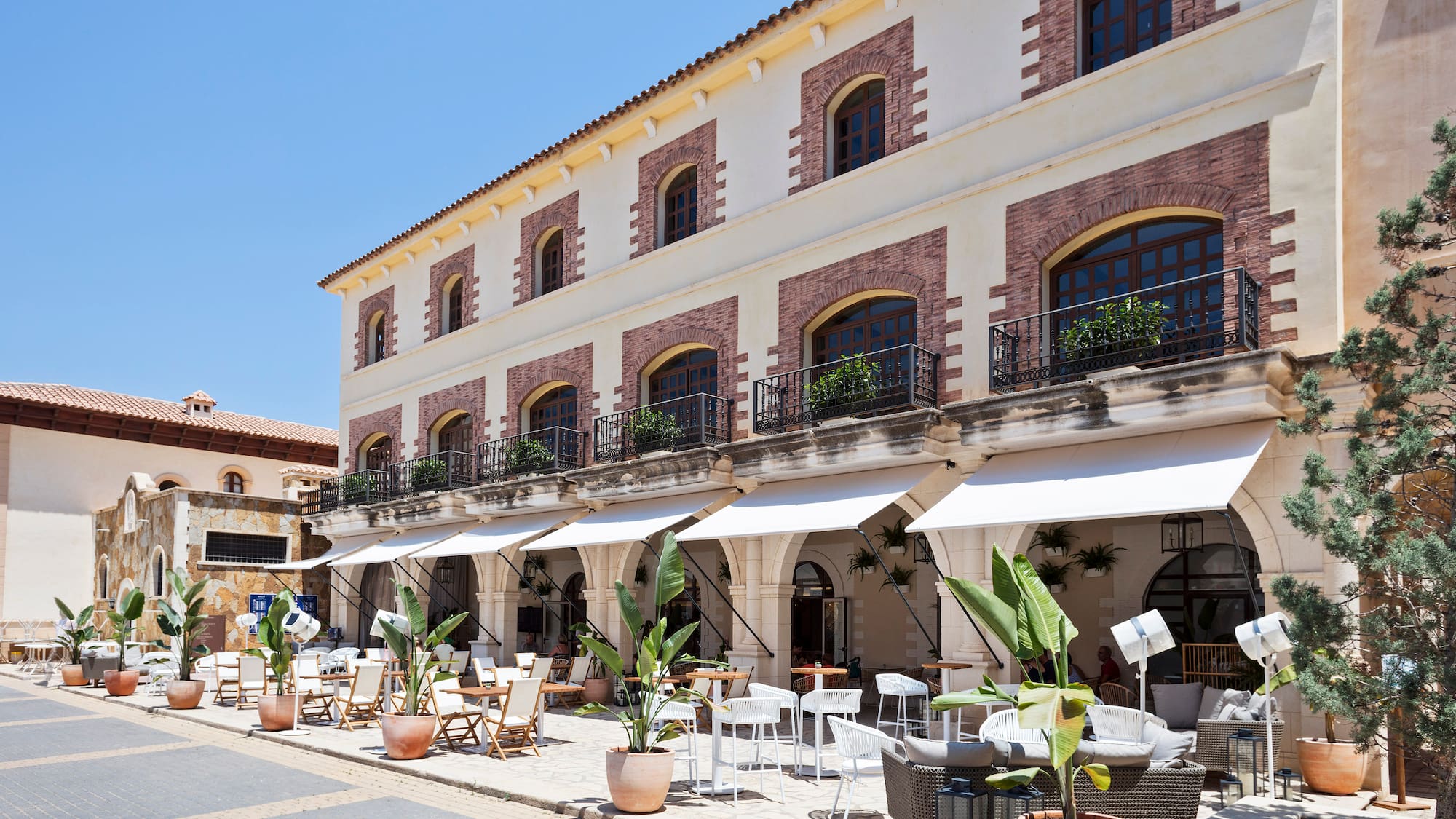a building with tables and chairs outside