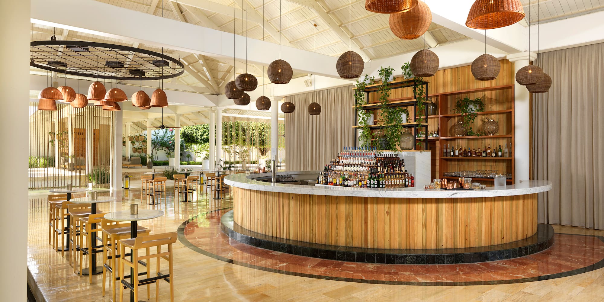 a bar with a counter and chairs