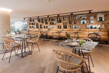 a restaurant with tables and chairs