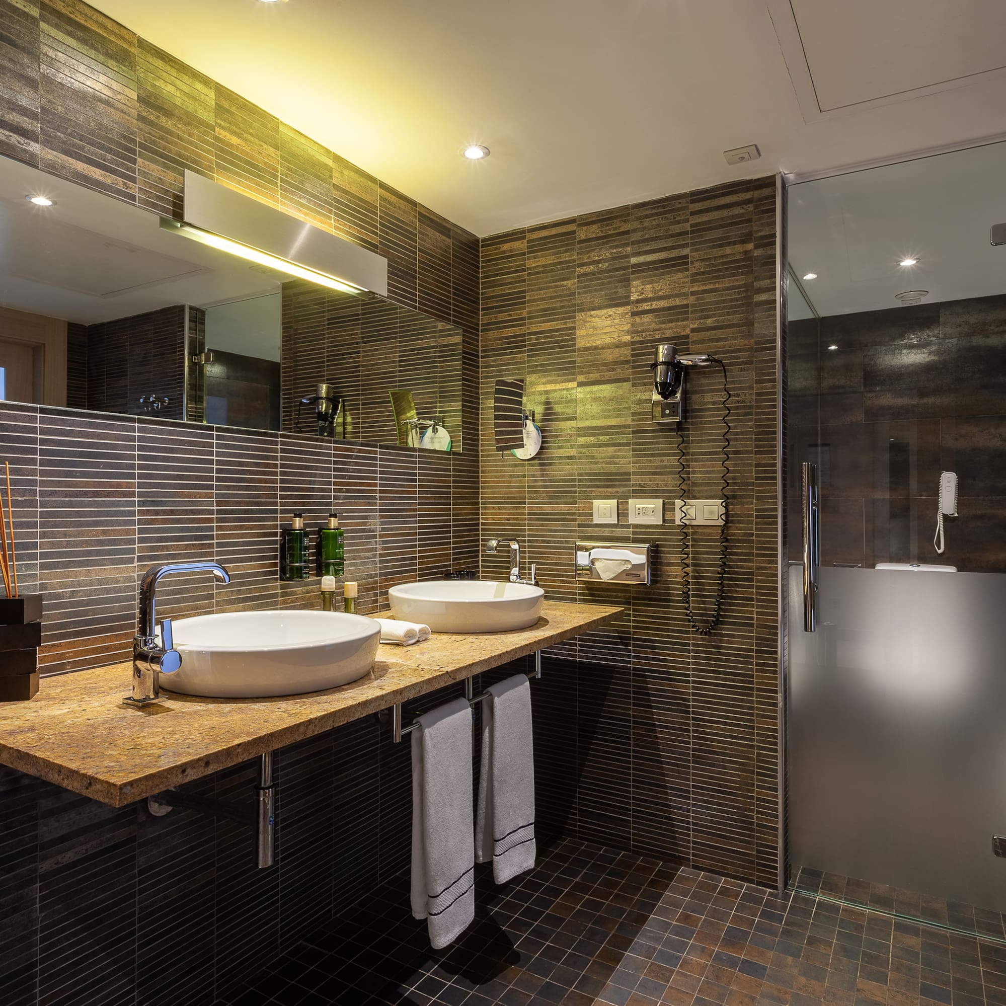 a bathroom with a shower and sink