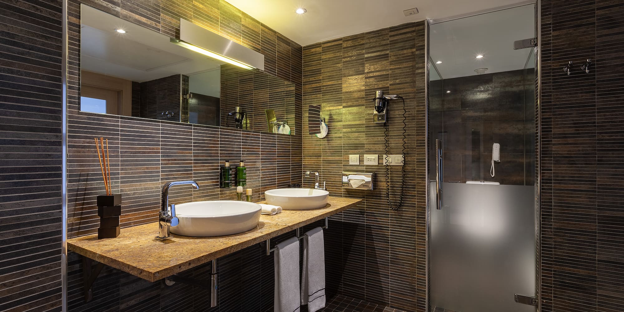 a bathroom with a shower and sink