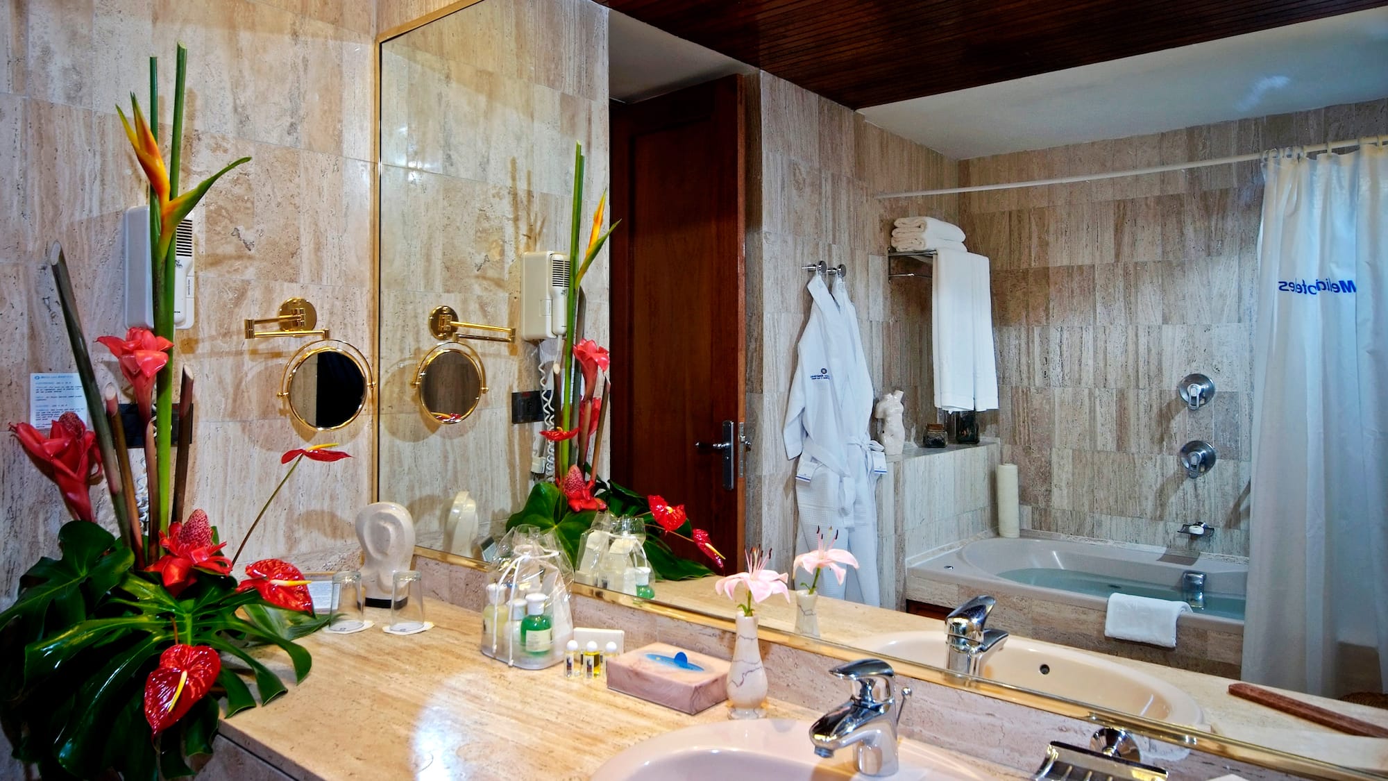 a bathroom with a large mirror and a bathtub
