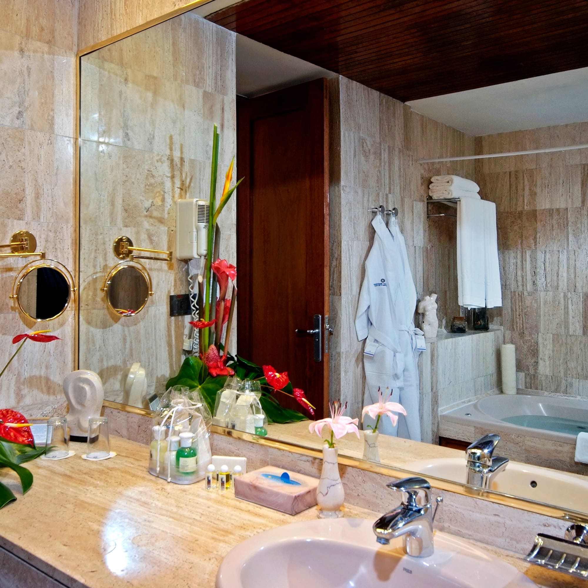 a bathroom with a large mirror and a bathtub