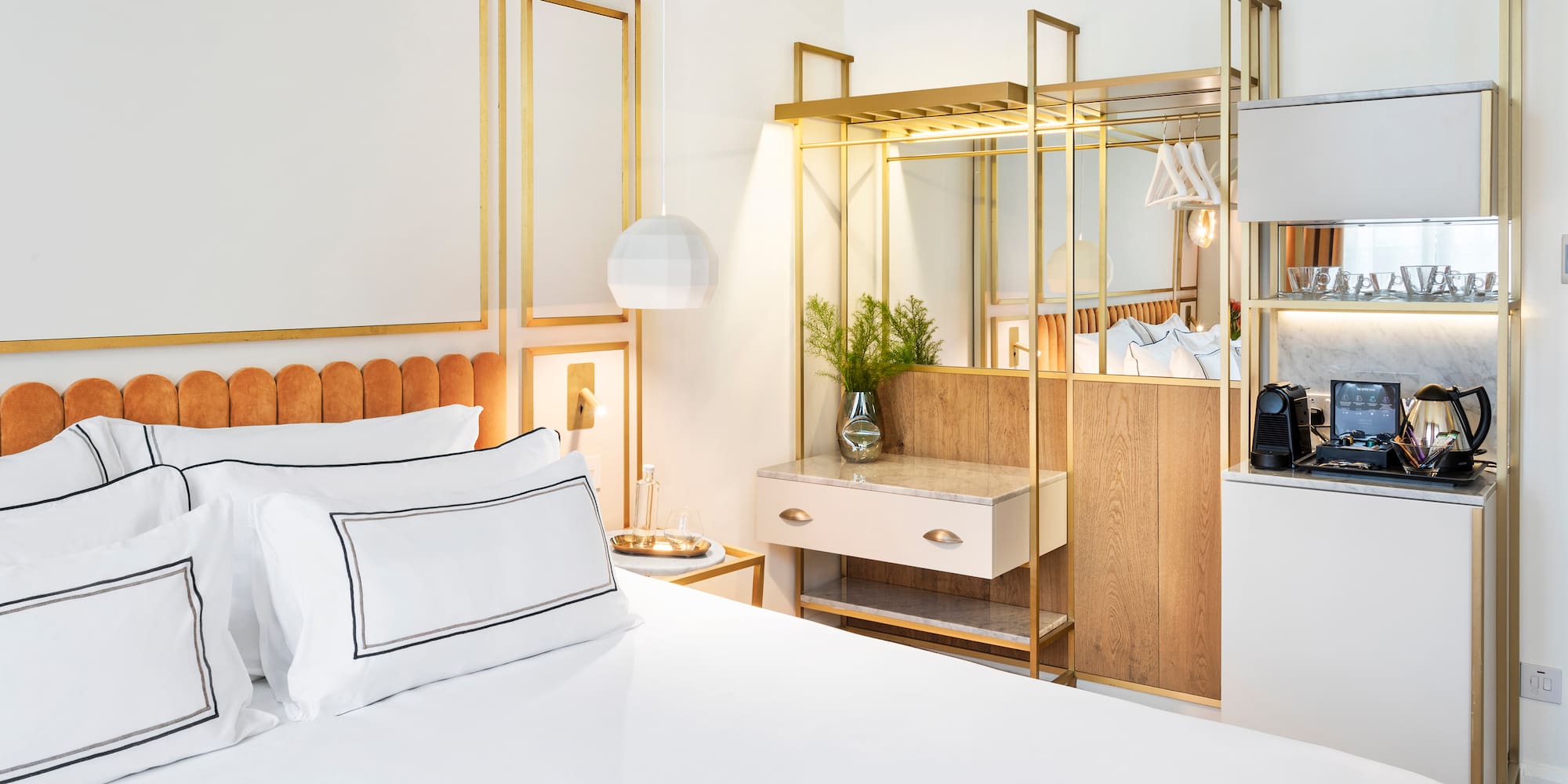 a bedroom with a bed and a mirror