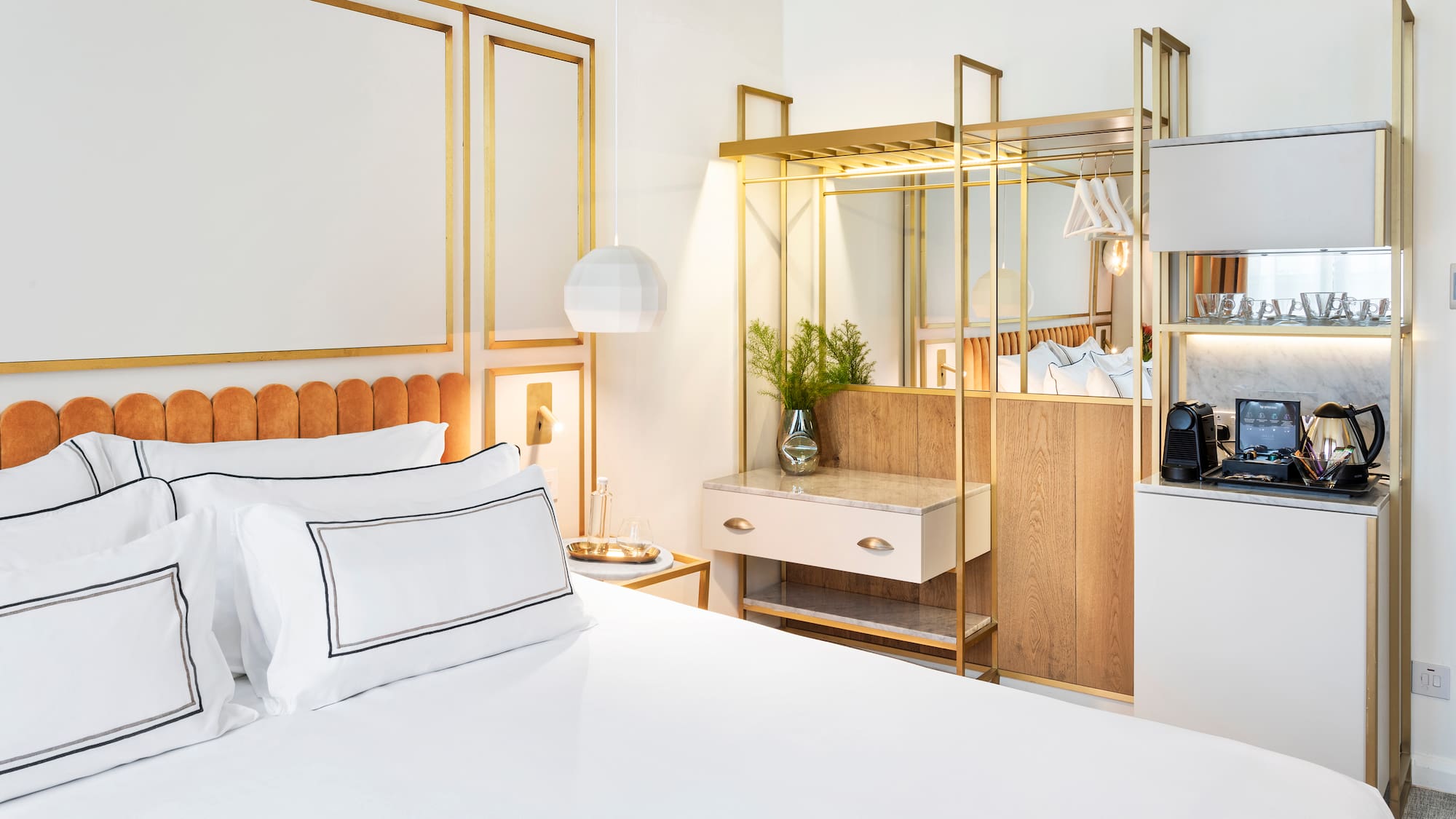 a bedroom with a bed and a mirror