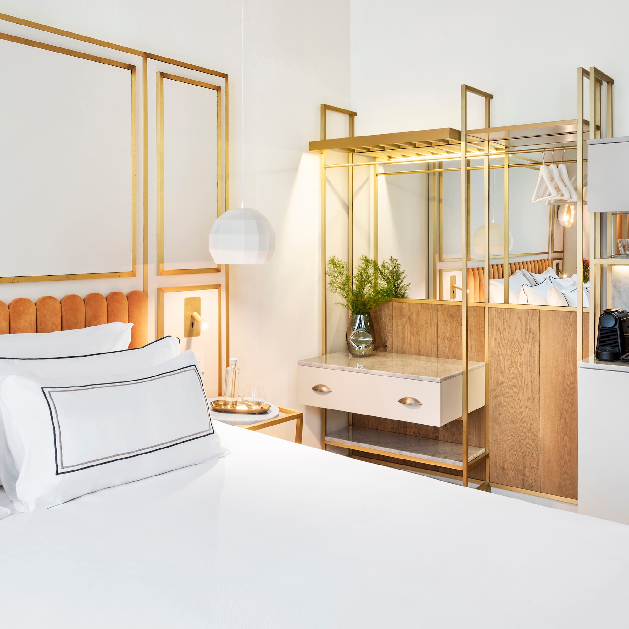 a bedroom with a bed and a mirror