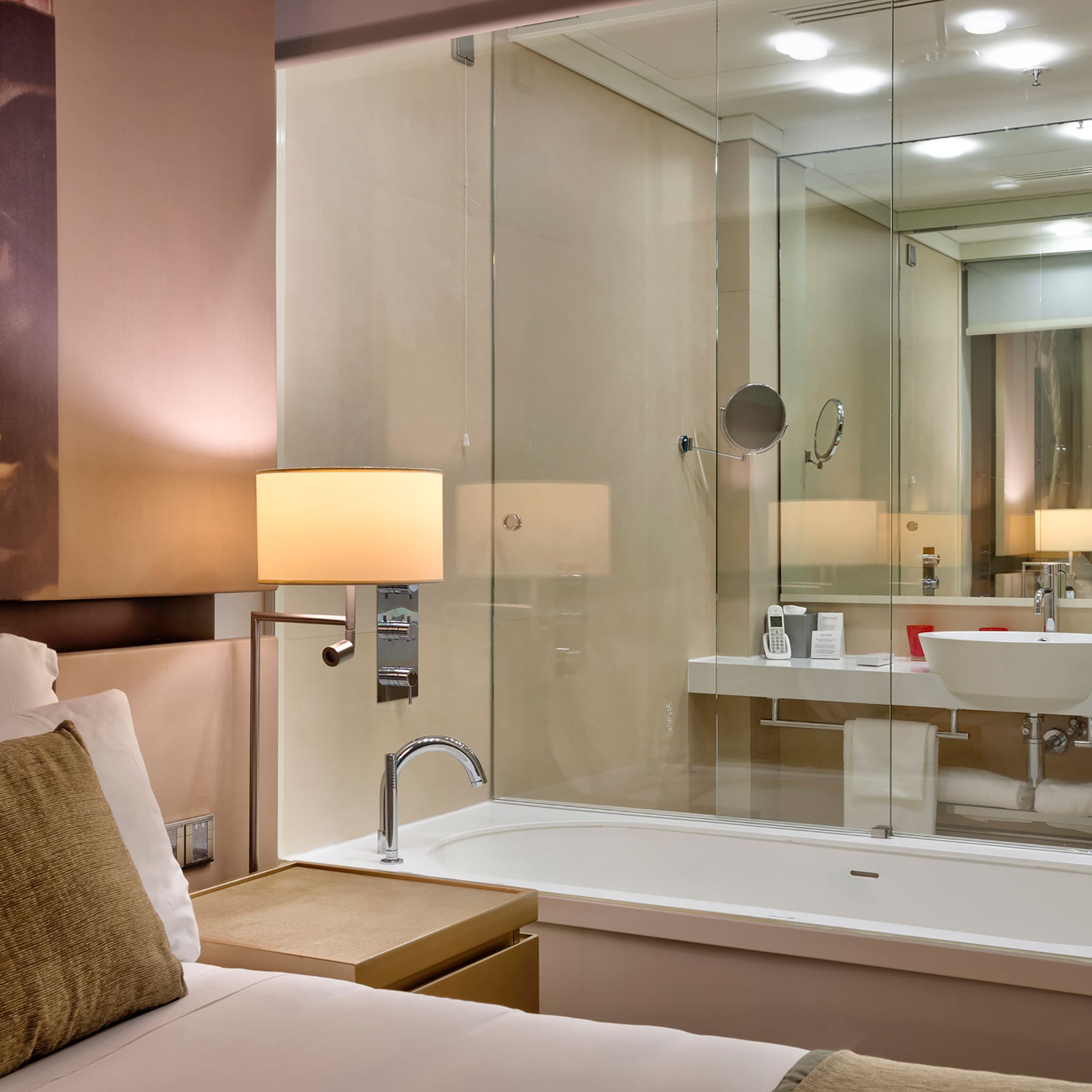 a bathroom with a glass shower door