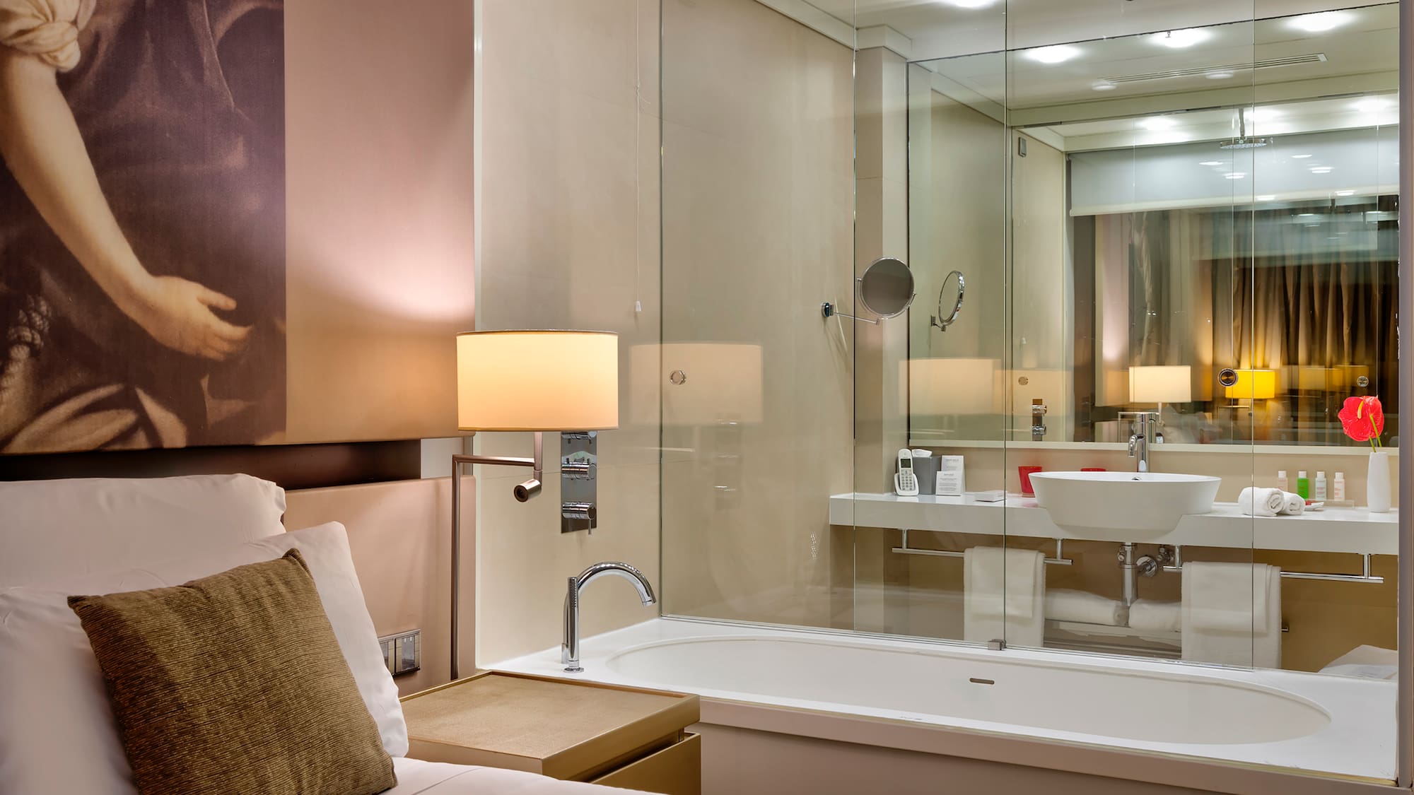 a bathroom with a glass shower door