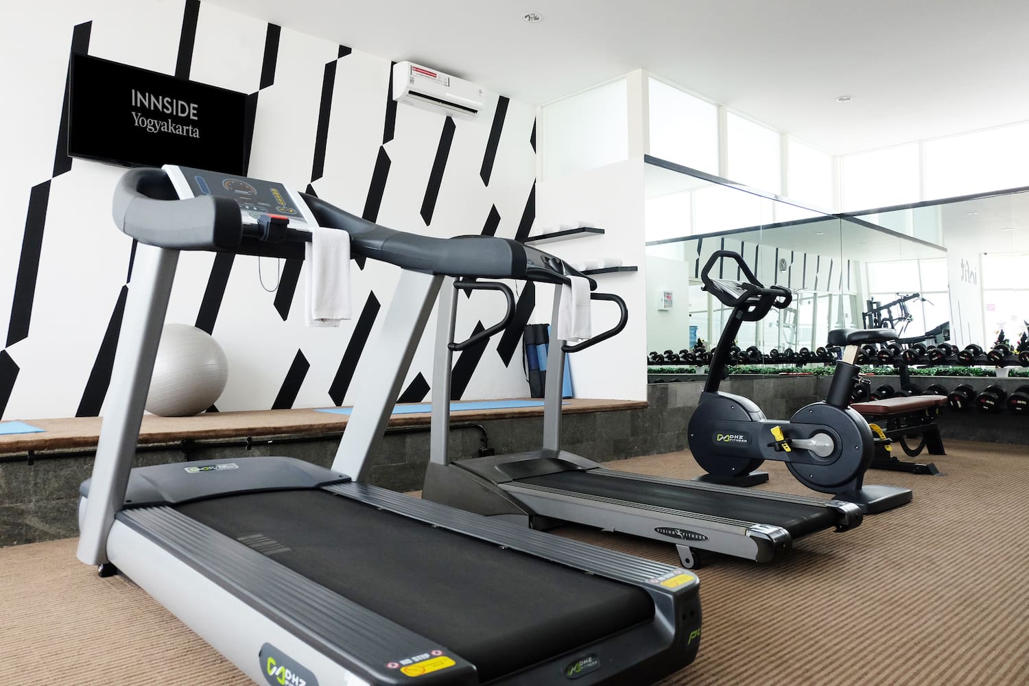 a room with treadmills and exercise machines