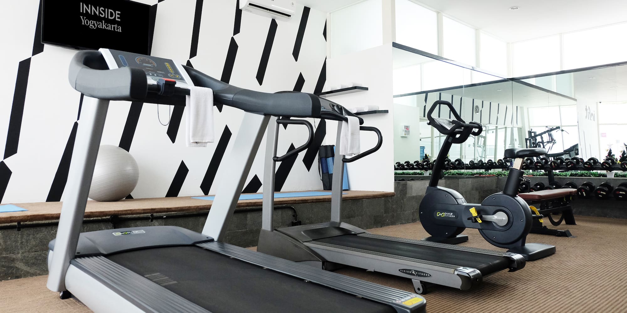a room with treadmills and exercise machines