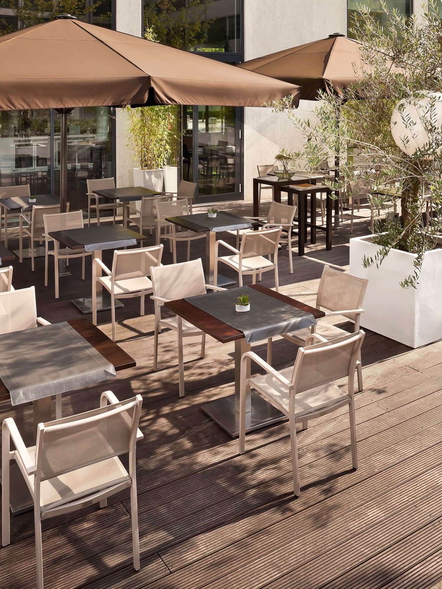 a patio with tables and chairs