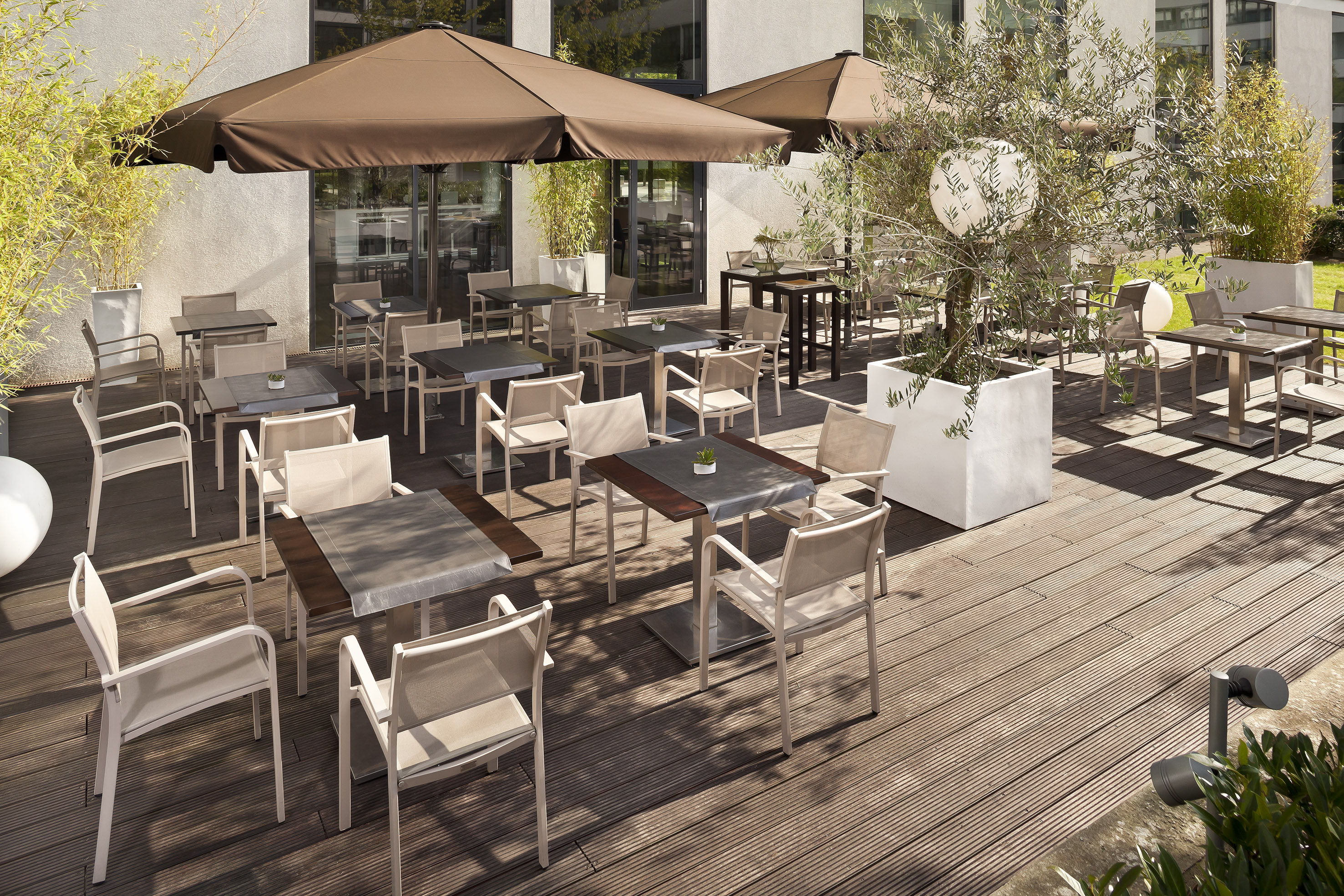 a patio with tables and chairs